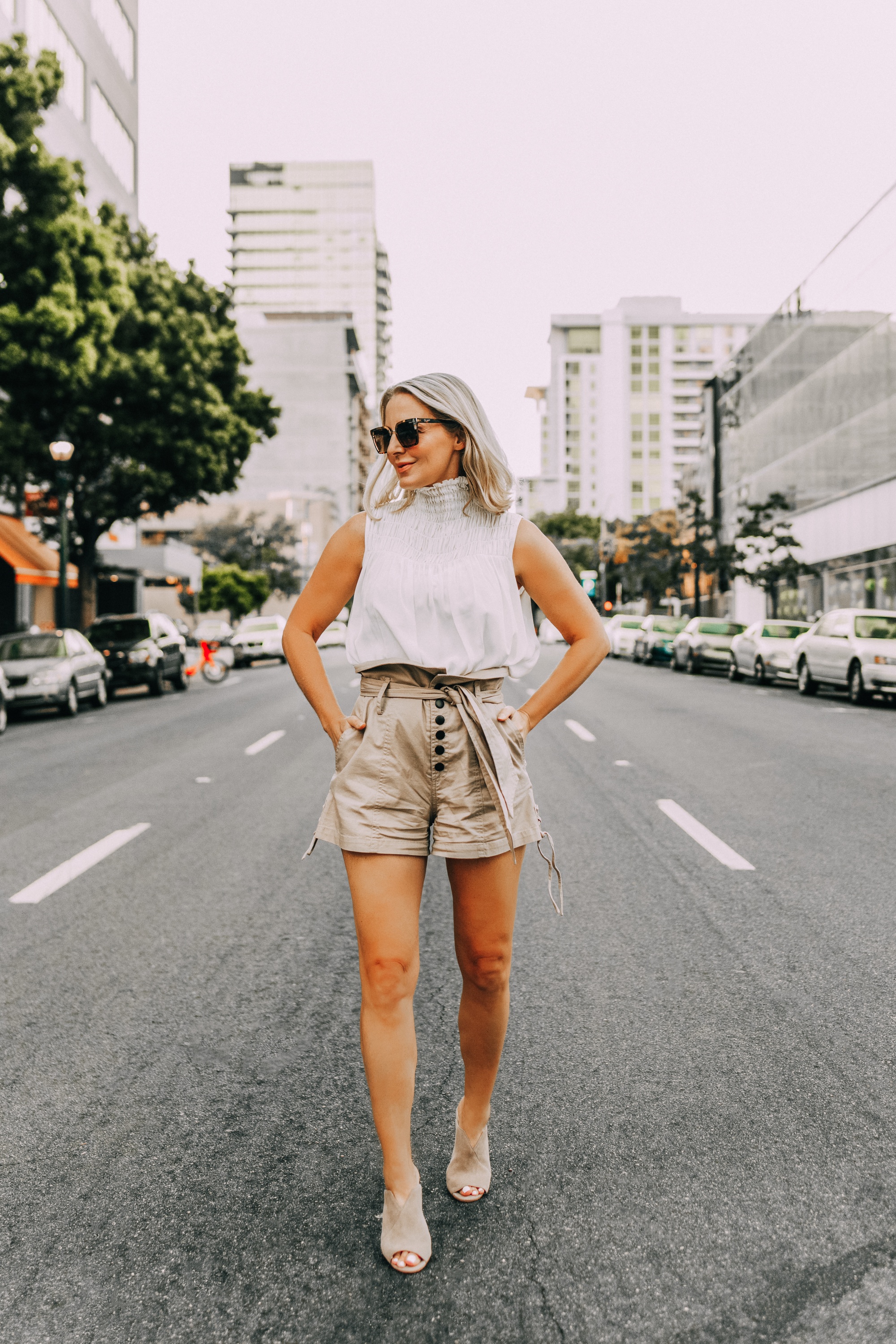 Paper bag shorts, fashion blogger Erin Busbee of BusbeeStyle.com wearing paper bag shorts by Marissa Webb with a white Frame sleeveless high neck top and Vince Camuto peep toe mules in San Diego, CA