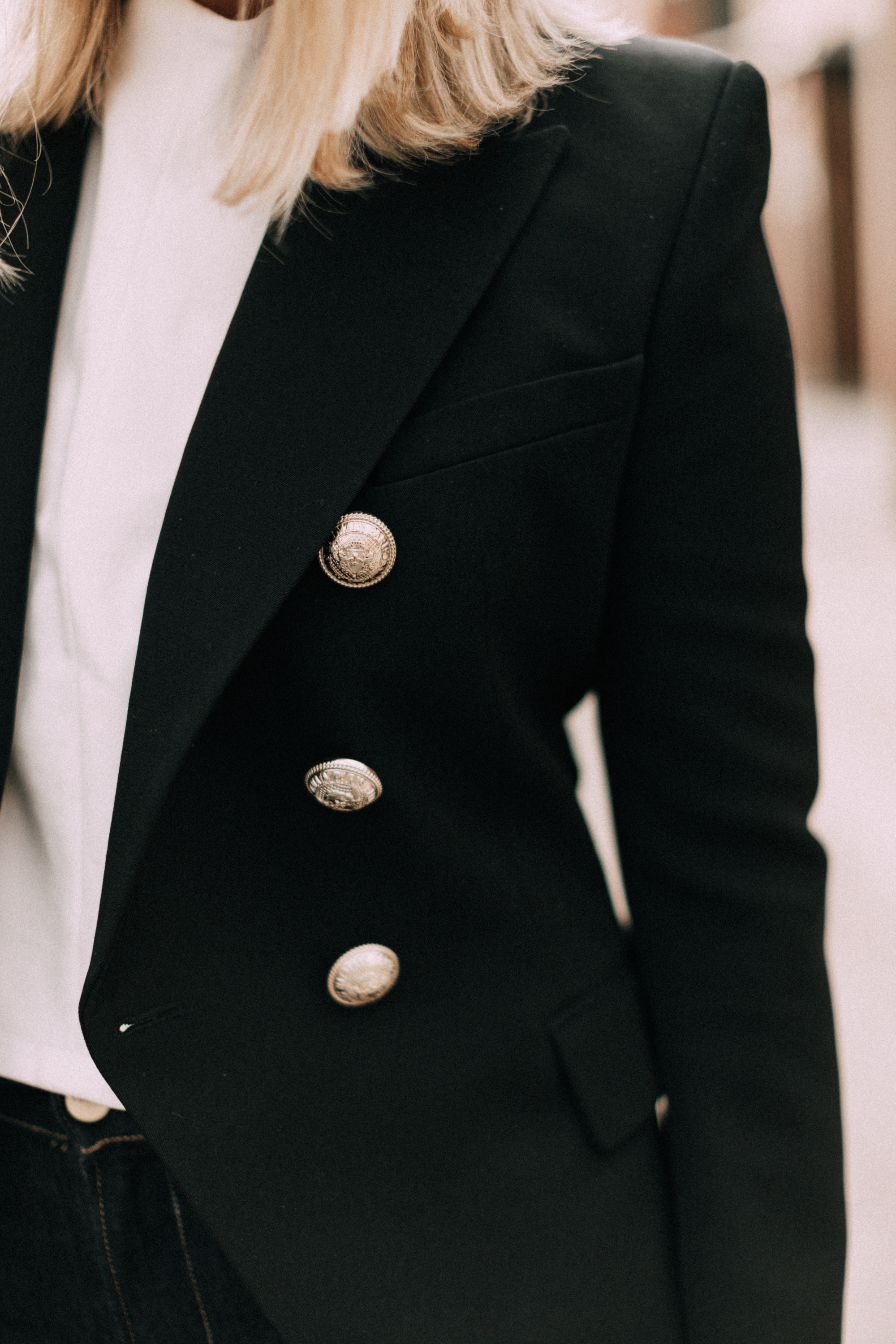black Balmain blazer with gold buttons outfit worn with white top