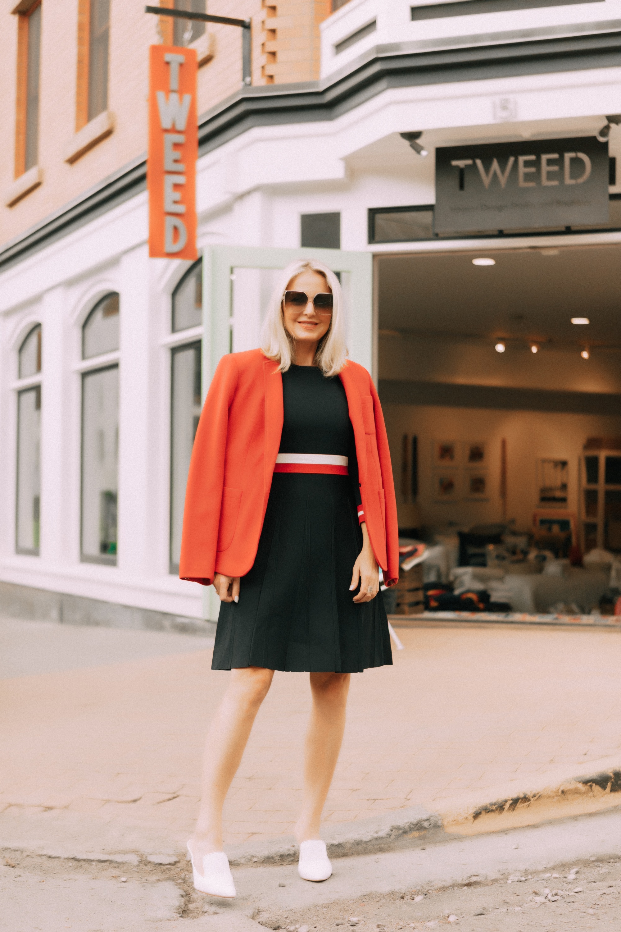 Colorful Office Outfits, Fashion blogger Erin Busbee of BusbeeStyle.com wearing a red knit blazer and navy striped fit and flare dress by Tommy Hilfiger in Telluride, CO