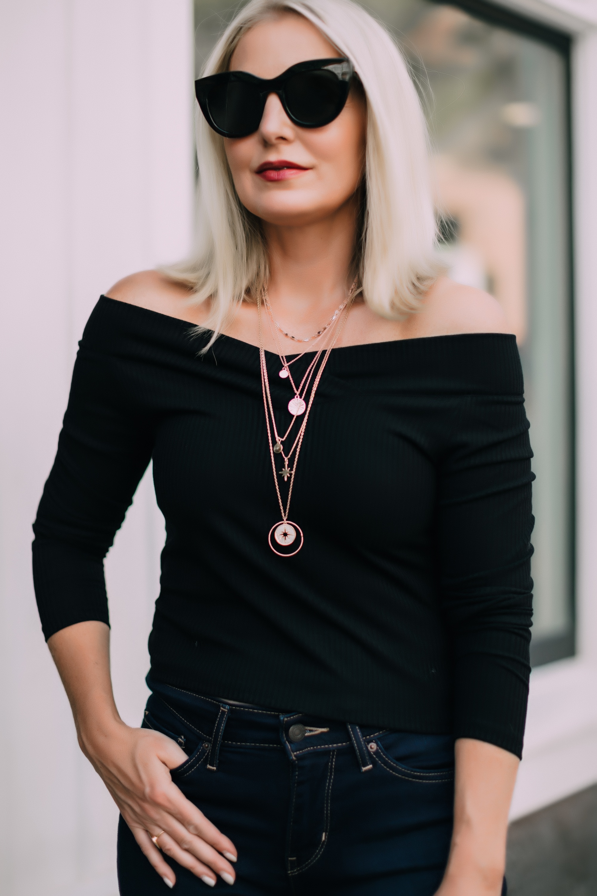 How to layer necklaces, Fashion blogger Erin Busbee of BusbeeStyle.com wearing Levi jeans, black studded sandals, black off the shoulder top, and a two pre-layered necklaces from JCPenney in Telluride, CO