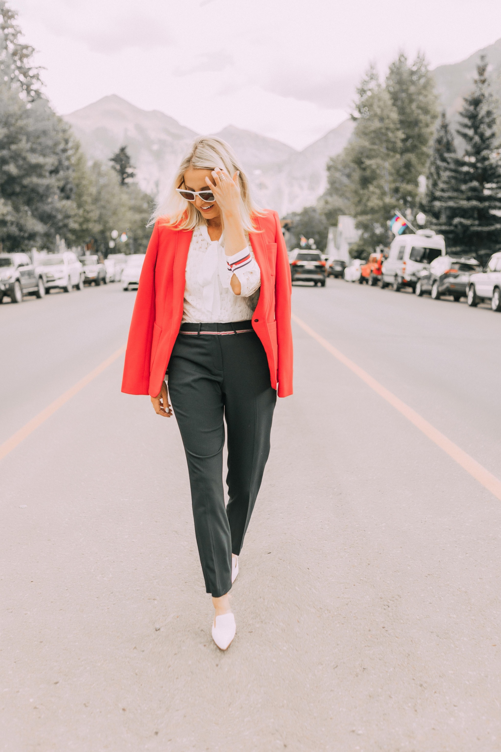 Colorful Office Outfits, Fashion blogger Erin Busbee of BusbeeStyle.com wearing a red knit blazer, navy pants, and white lace button down by Tommy Hilfiger in Telluride, CO