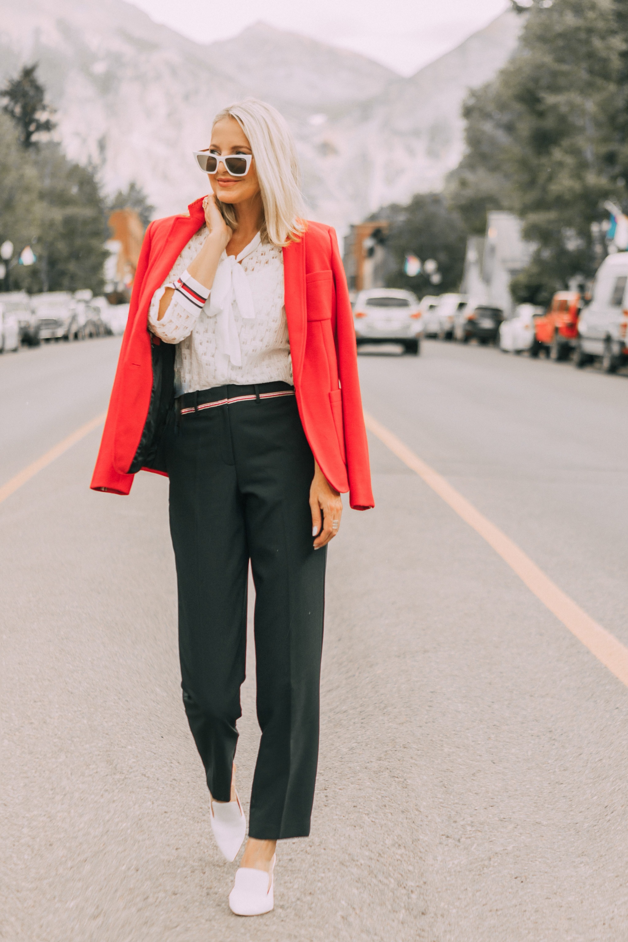 Colorful Office Outfits, Fashion blogger Erin Busbee of BusbeeStyle.com wearing a red knit blazer, navy pants, and white lace button down by Tommy Hilfiger in Telluride, CO