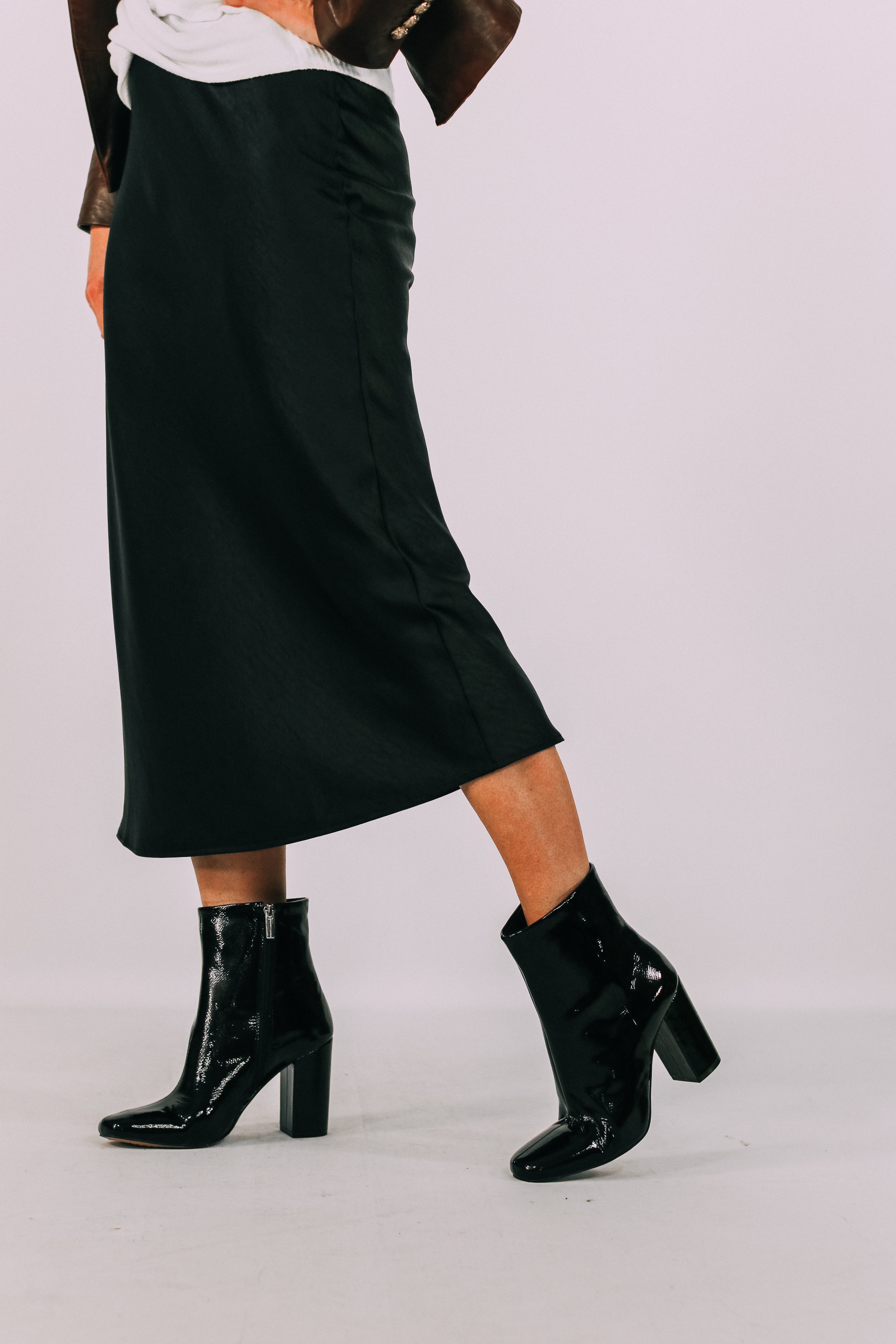 Square Toe Booties, Fashion blogger Erin Busbee of BusbeeStyle.com featuring black patent square toe booties by Vince Camuto with a satin black midi skirt in Telluride, CO