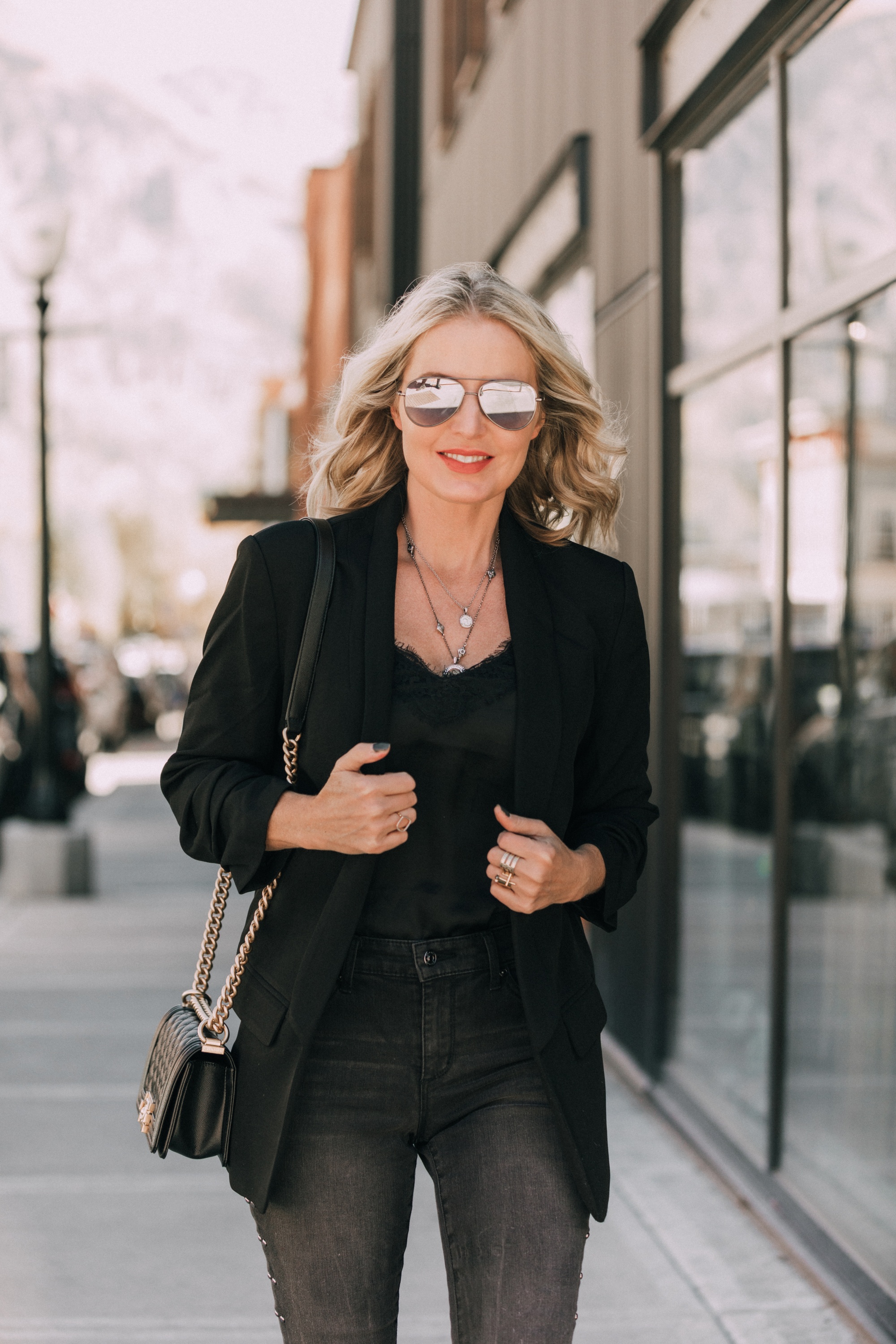Boyfriend Blazer, Fashion blogger Erin Busbee of BusbeeStyle.com wearing a black boyfriend blazer and black studded jeans Scoop with a black cami and black bag from Walmart in Telluride, CO