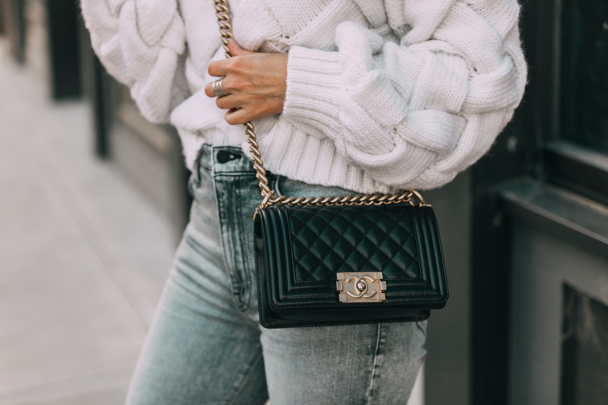classic handbags all women should own, must-have handbag styles, black leather quilted Chanel crossbody handbag