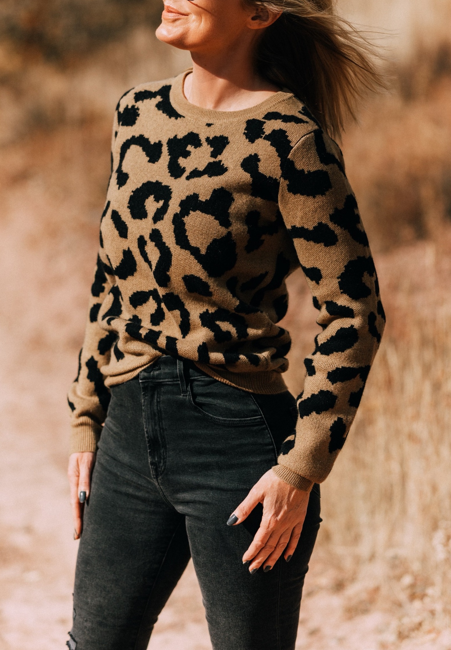 tan madeleine thompson leopard print crewneck sweater outfit with gray J brand jeans