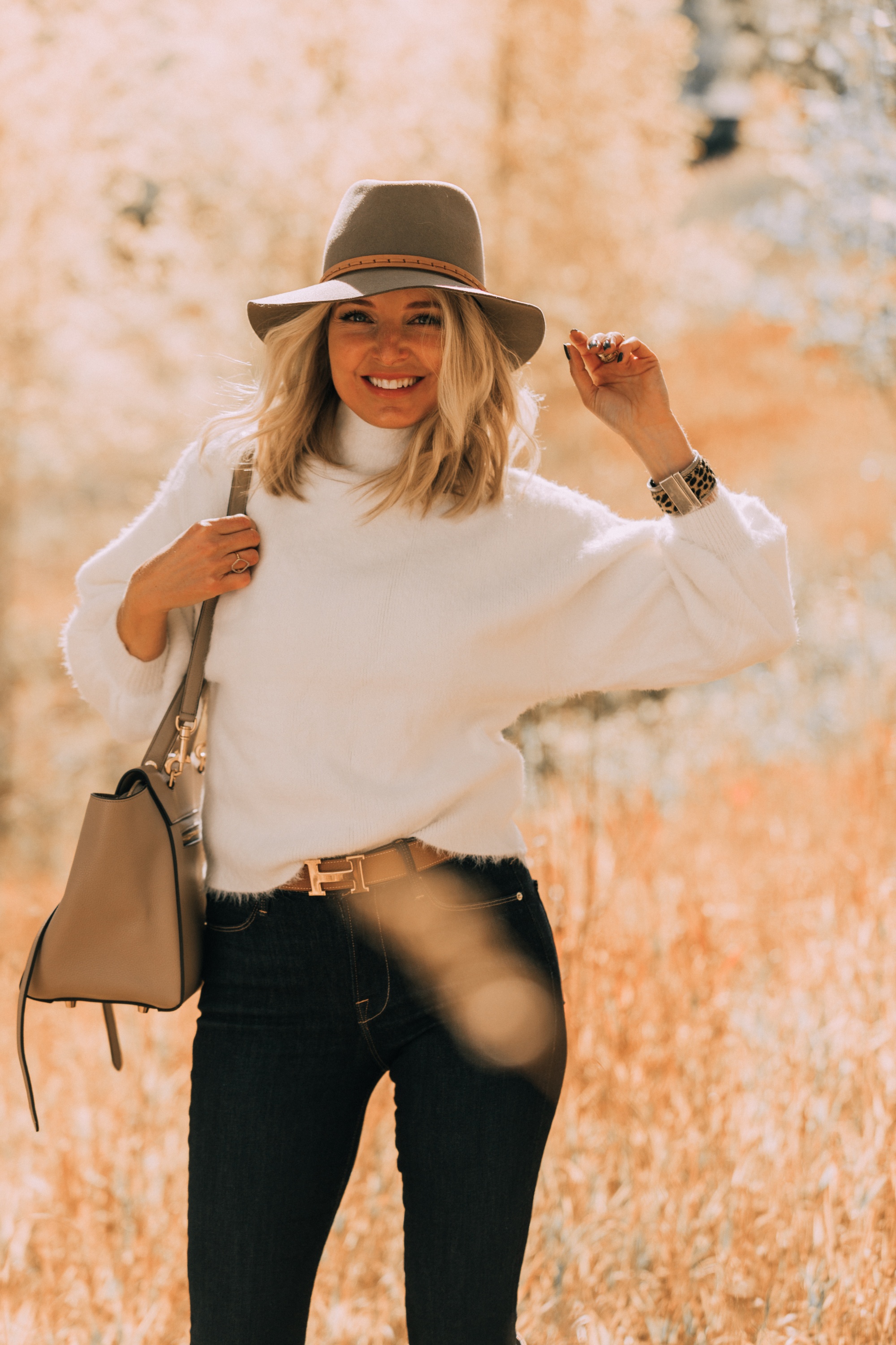 Fuzzy Sweaters, Fashion blogger Erin Busbee of BusbeeStyle.com wearing a white fuzzy sweater by Line & Dot with rag & bone skinny jeans, brown knee high boots, celine belt bag, and treasure & bond floppy brim hat in Telluride, Colorado