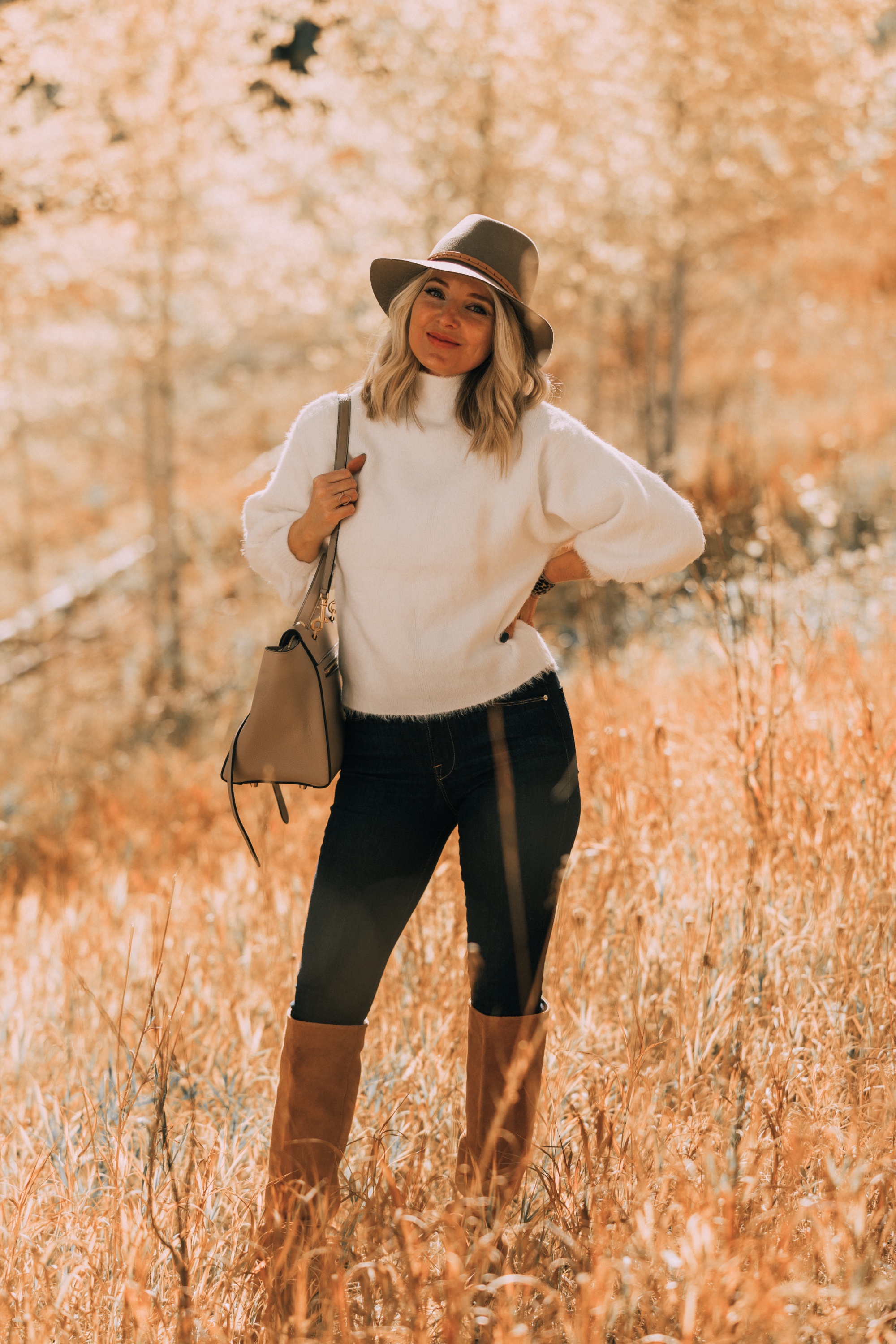 Fuzzy Sweaters, Fashion blogger Erin Busbee of BusbeeStyle.com wearing a white fuzzy sweater by Line & Dot with rag & bone skinny jeans, brown knee high boots, celine belt bag, and treasure & bond floppy brim hat in Telluride, Colorado