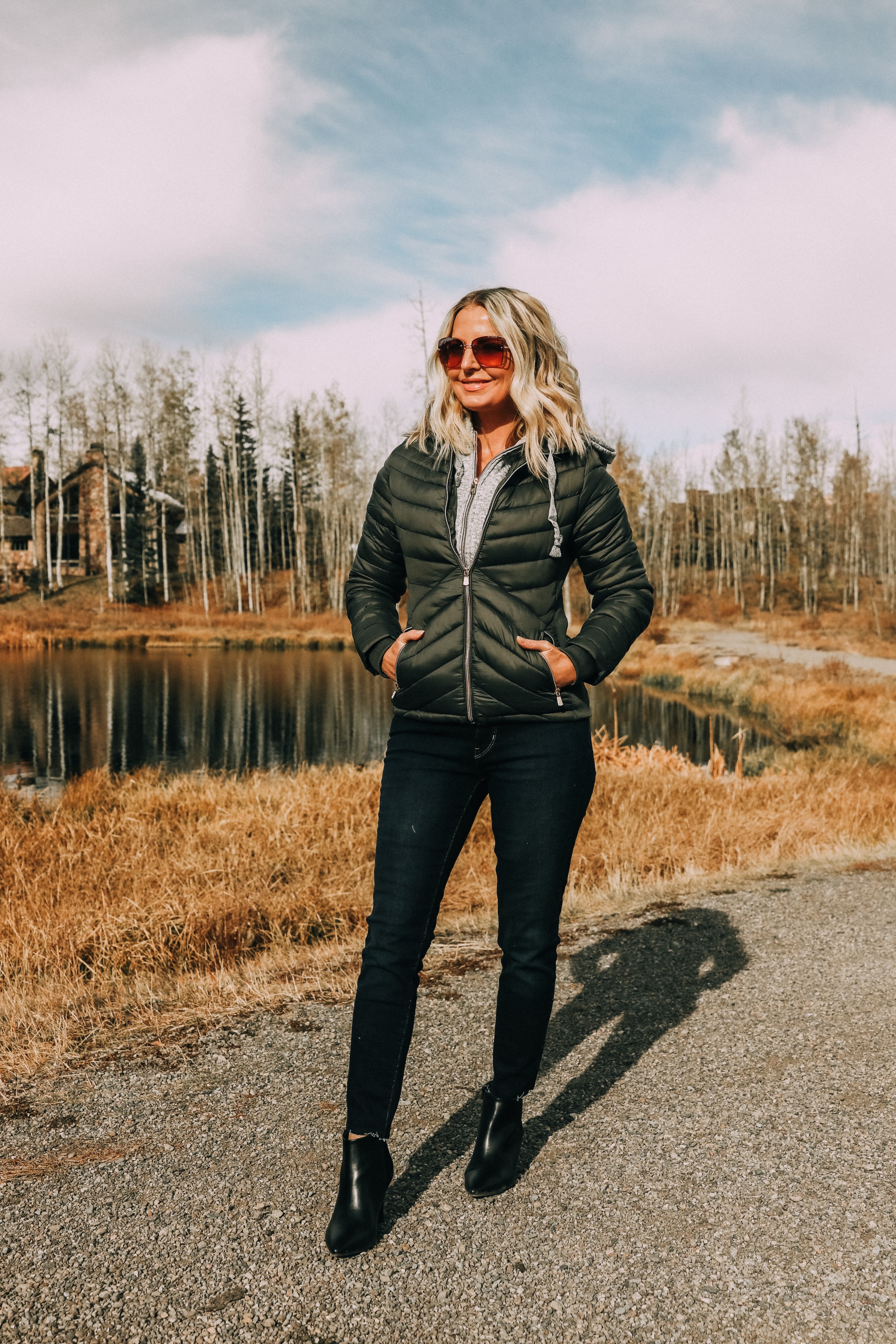 fashion blogger erin busbee wearing affordable puffer jacket levis 711 skinny jeans with black heeled booties from JCPenney