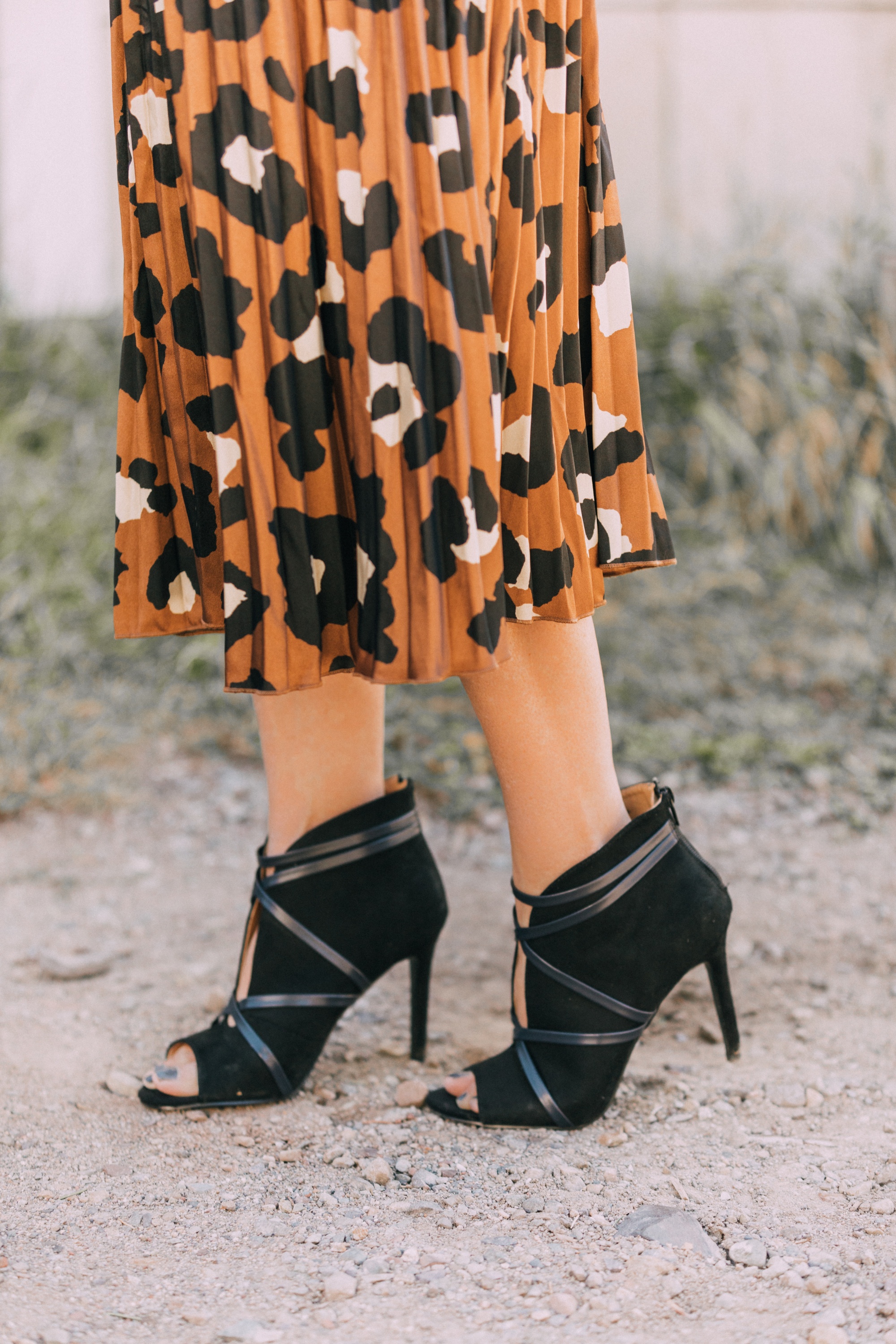pleated leopard print midi skirt with open toe black heeled booties