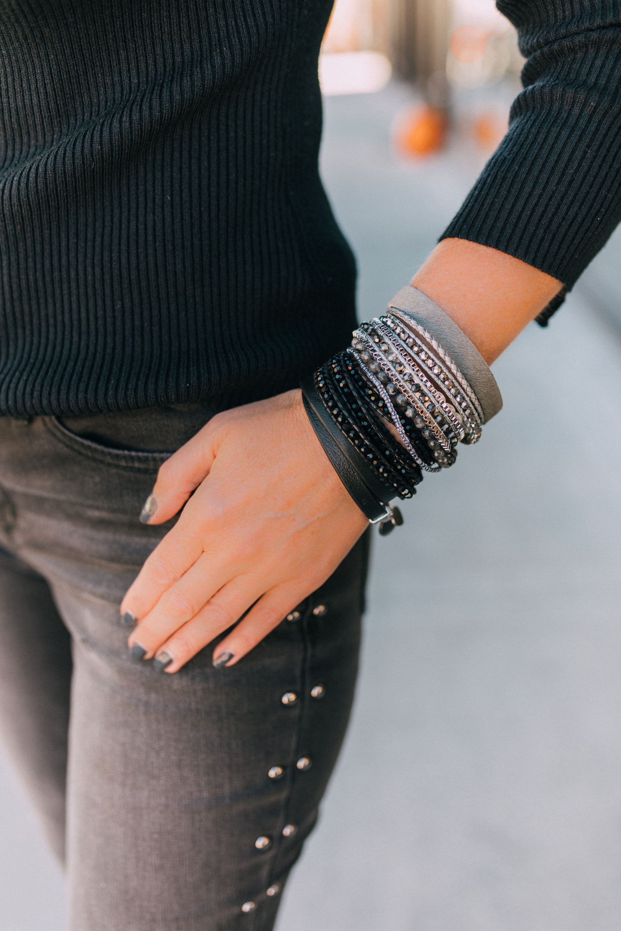 Warp Bracelets, Fashion blogger Erin Busbee of BusbeeStyle.com featuring the Mendoza, Midnight Mist, and Double Wrap bracelets by Victoria Emerson on Telluride, CO while wearing black pumps by Jimmy Choo, black studded jeans by Scoop from Walmart, and ribbed mock neck top