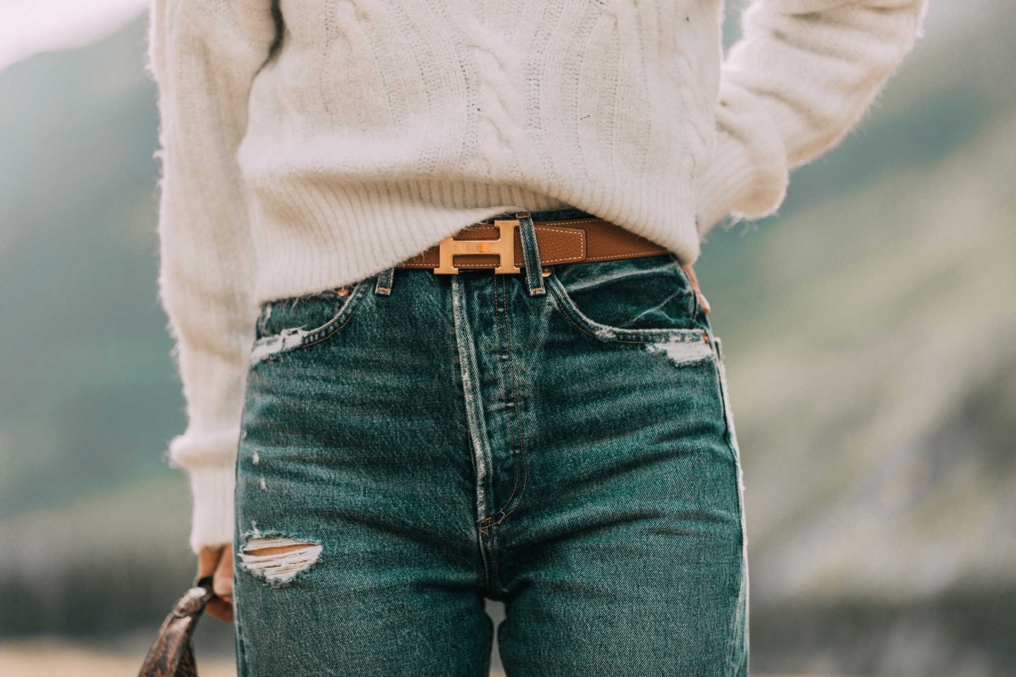 Women's fashion blogger, Erin Busbee, shares 5 fashion tips for women over 40 and recommends a leather belt hole punch to adjust belt sizing.