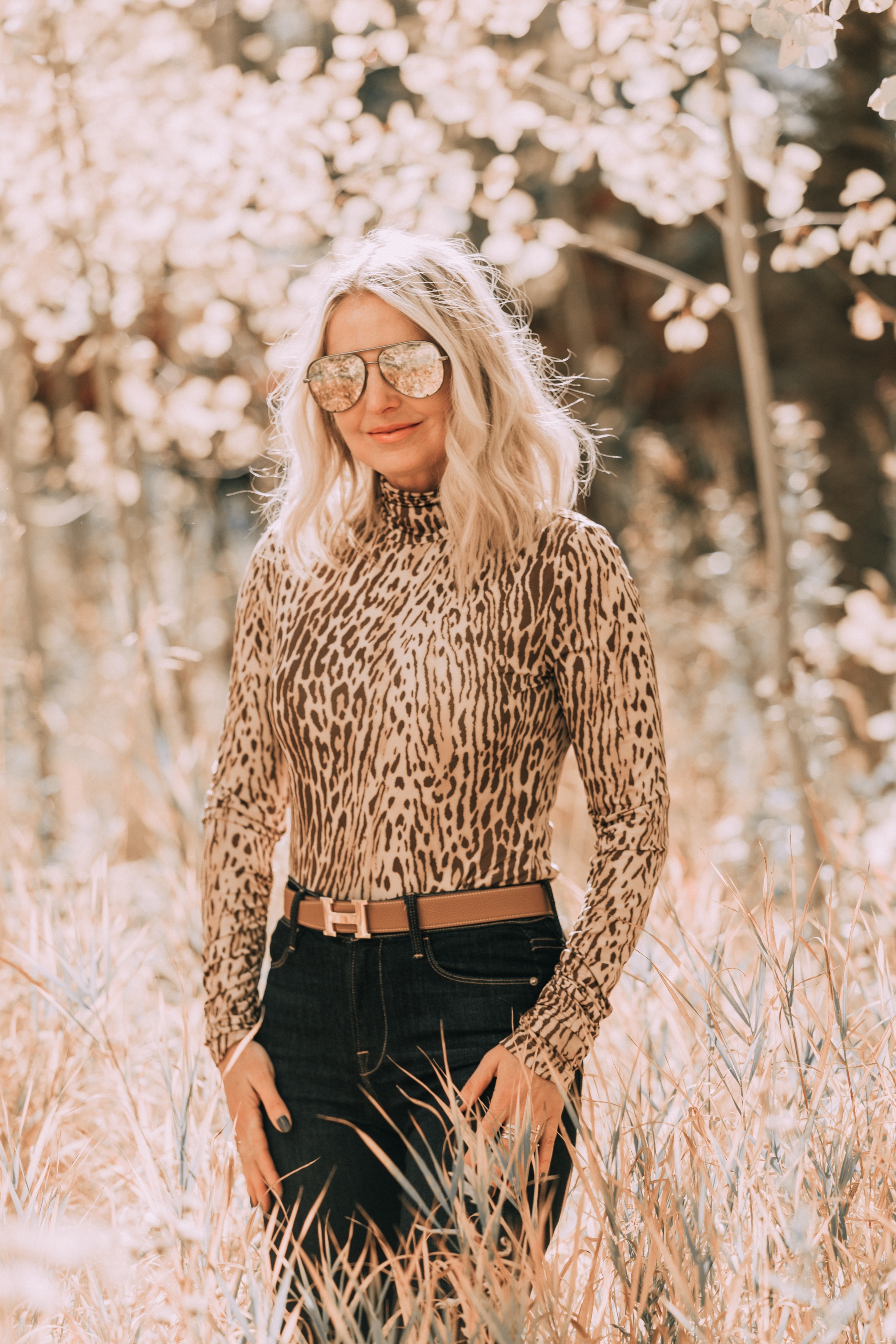Neutral Fall Outfit, Fashion blogger Erin Busbee of BusbeeStyle.com wearing the camel brown Nordstrom signature blazer with a Zimmerman leopard print turtleneck, rag & bone skinny jeans, Sam Edelman knee high suede boots, and hermes belt in Telluride, CO