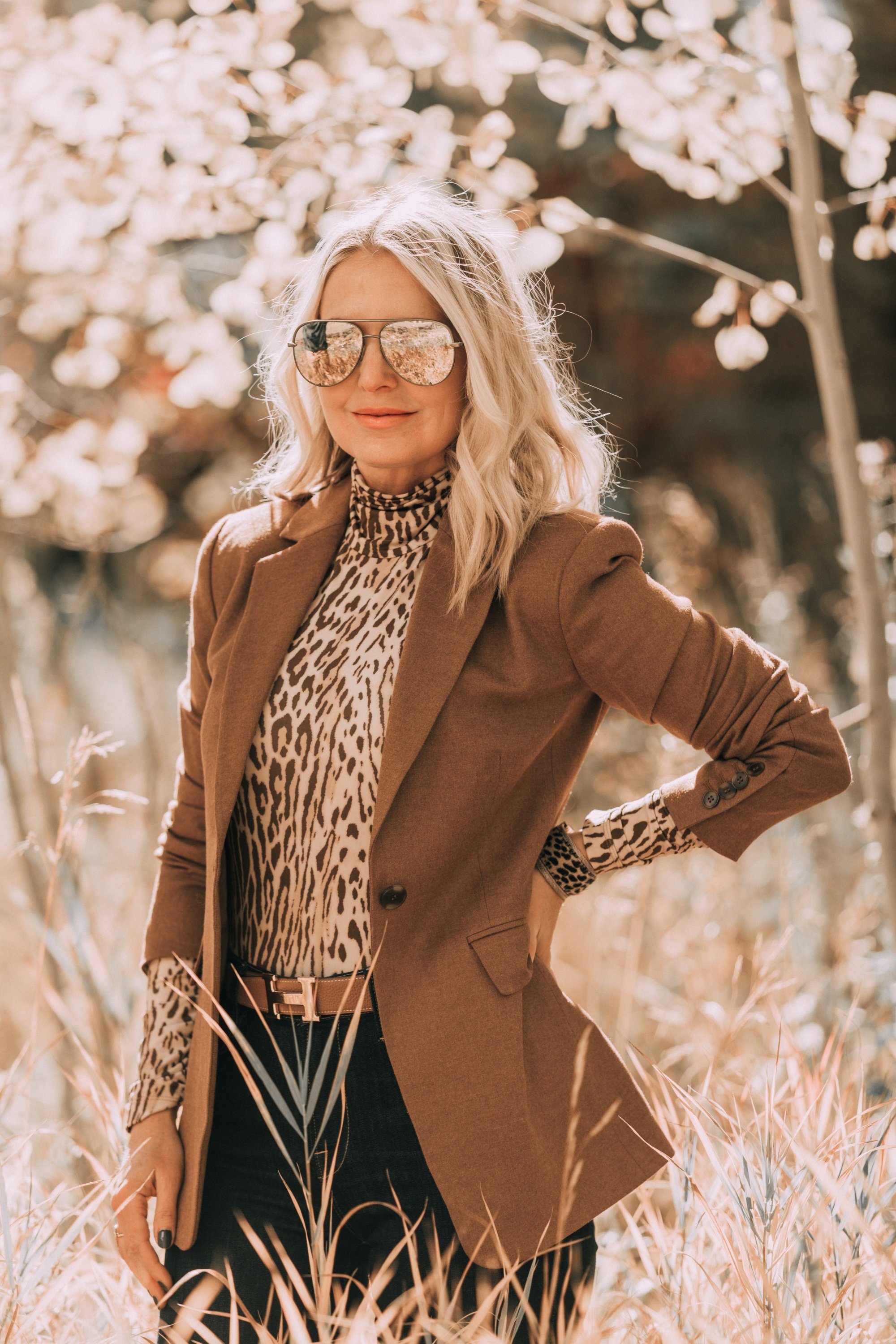 Neutral Fall Outfit, Fashion blogger Erin Busbee of BusbeeStyle.com wearing the camel brown Nordstrom signature blazer with a Zimmerman leopard print turtleneck, rag & bone skinny jeans, Sam Edelman knee high suede boots, and hermes belt in Telluride, CO