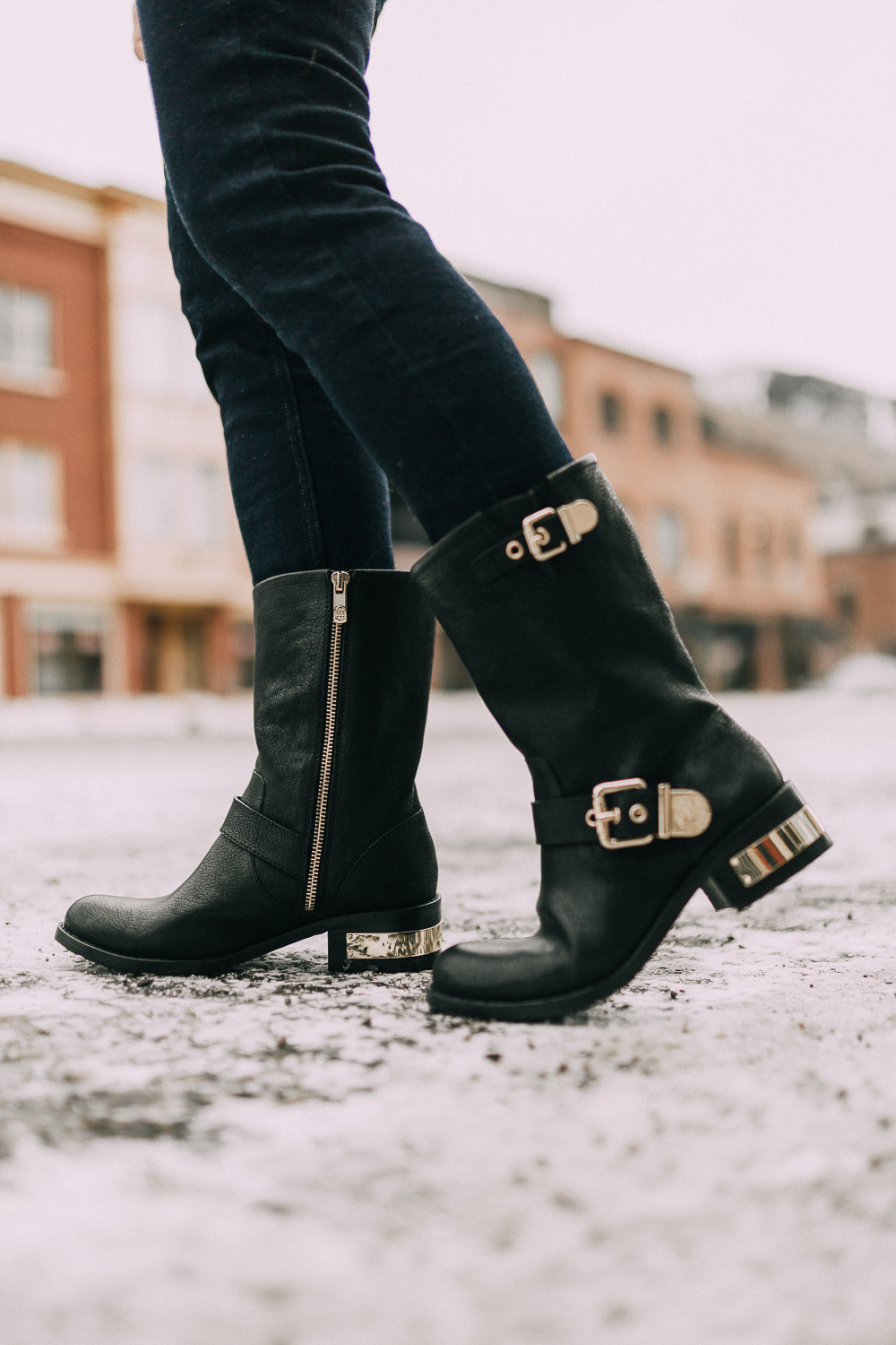 Vince Camuto Sale, Fashion blogger Erin Busbee of BusbeeStyle.com wearing the Vince Camuto Winchell moto boots with dark wash skinny jeans in Telluride, CO