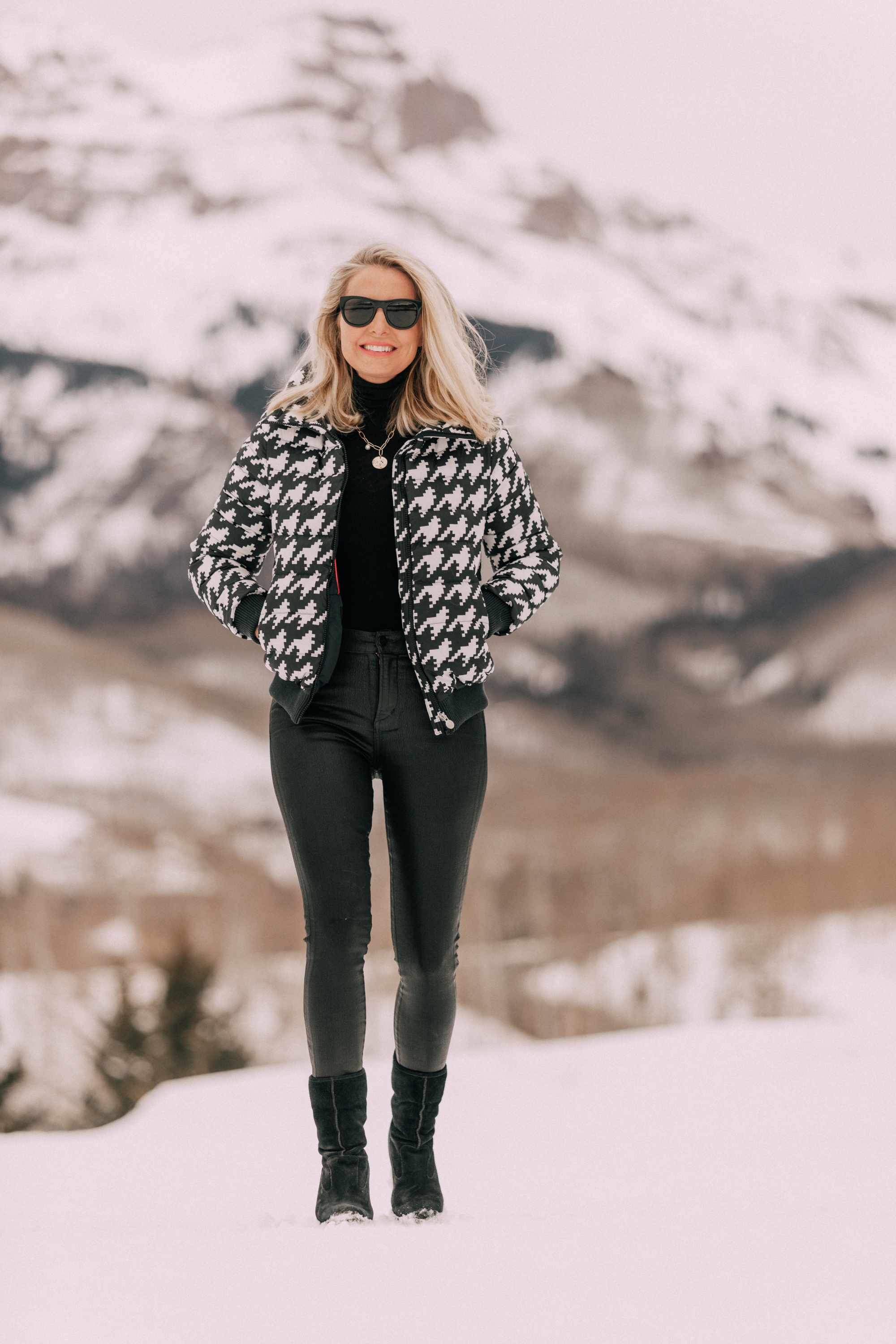Chic Puffers, Fashion blogger Erin Busbee of BusbeeStyle.com wearing black Rocket leatherette Skinny Jeans by Citizens of Humanity with a black cashmere turtleneck sweater by Aqua, and a houndstooth puffer jacket by Perfect Moment from Shopbop in the snow in Telluride, CO