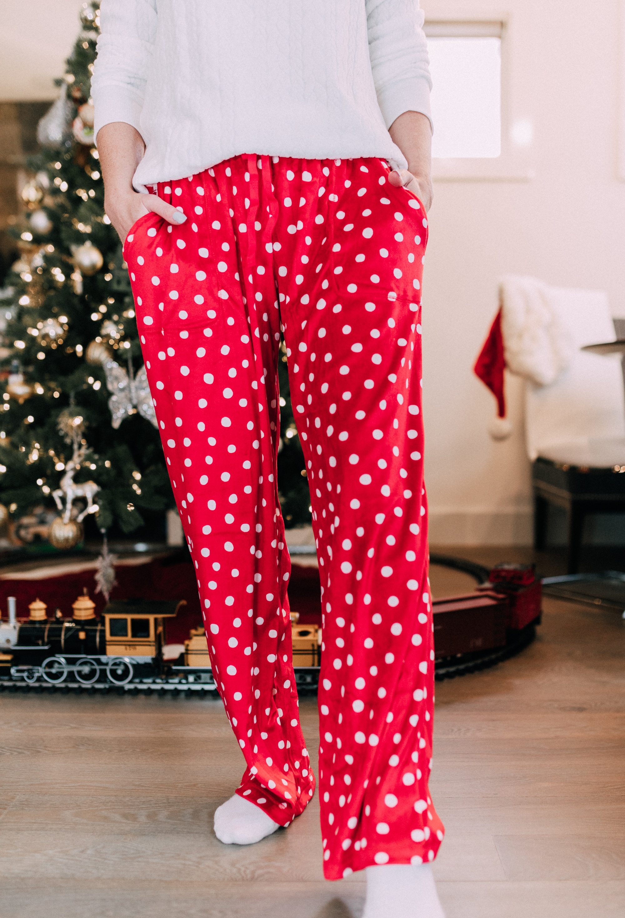 Holiday Traditions, Fashion blogger Erin Busbee of BusbeeStyle.com wearing red fleece polka dot pajama pants with a fleece cable knit pullover from Jockey in Telluride, CO