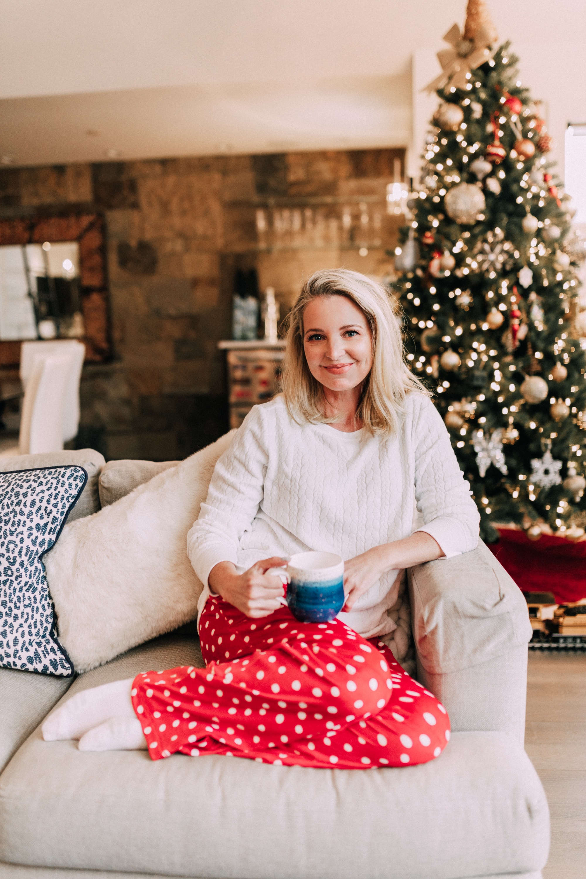 Holiday Traditions, Fashion blogger Erin Busbee of BusbeeStyle.com wearing red fleece polka dot pajama pants with a fleece cable knit pullover from Jockey in Telluride, CO