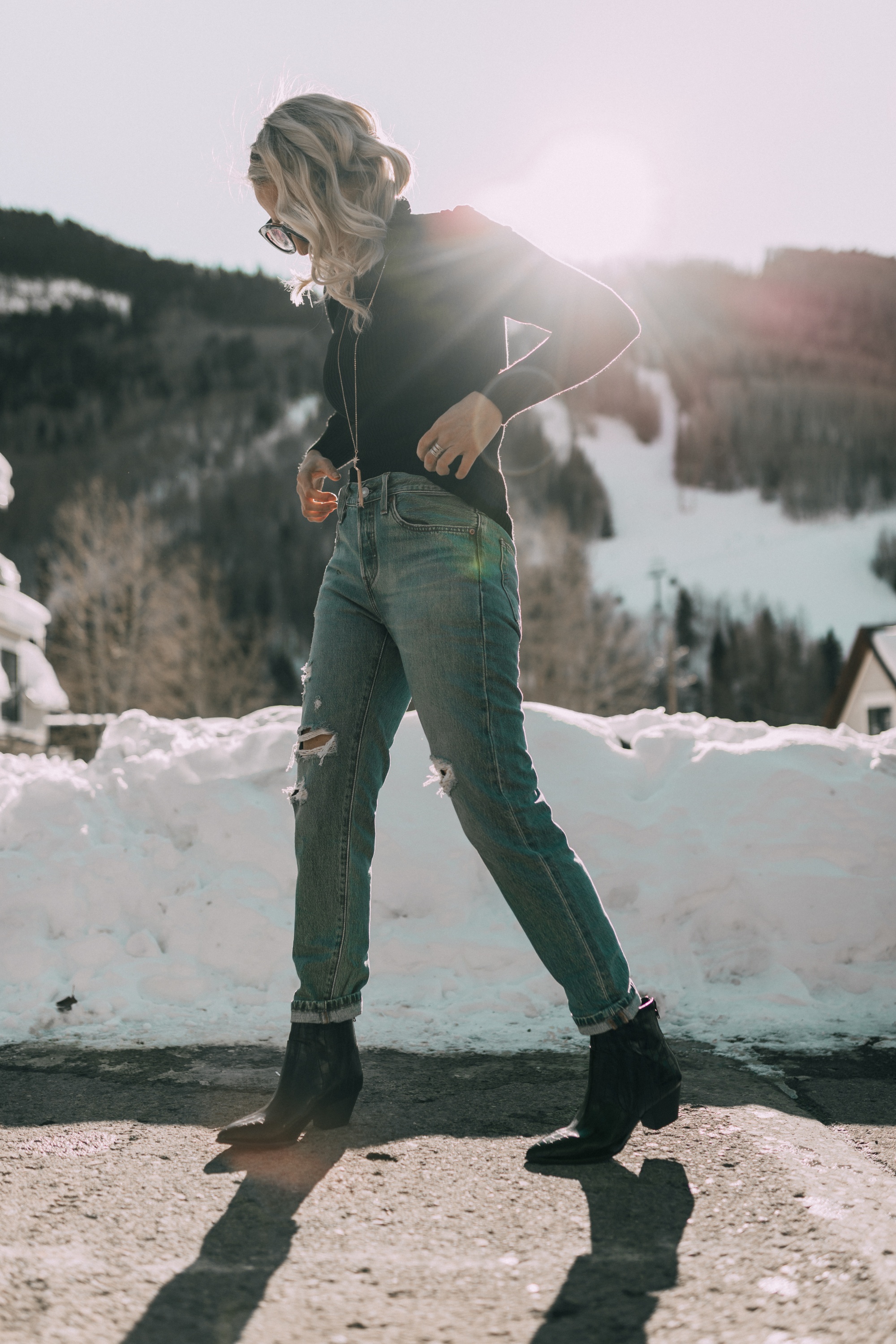 Levi jeans, fashion blogger Erin Busbee of BusbeeStyle.com wearing Levi's Mile High Super Skinny Jeans with a black puff sleeve pullover sweater and black croc-embossed boots from JCPenney in Telluride, Colorado