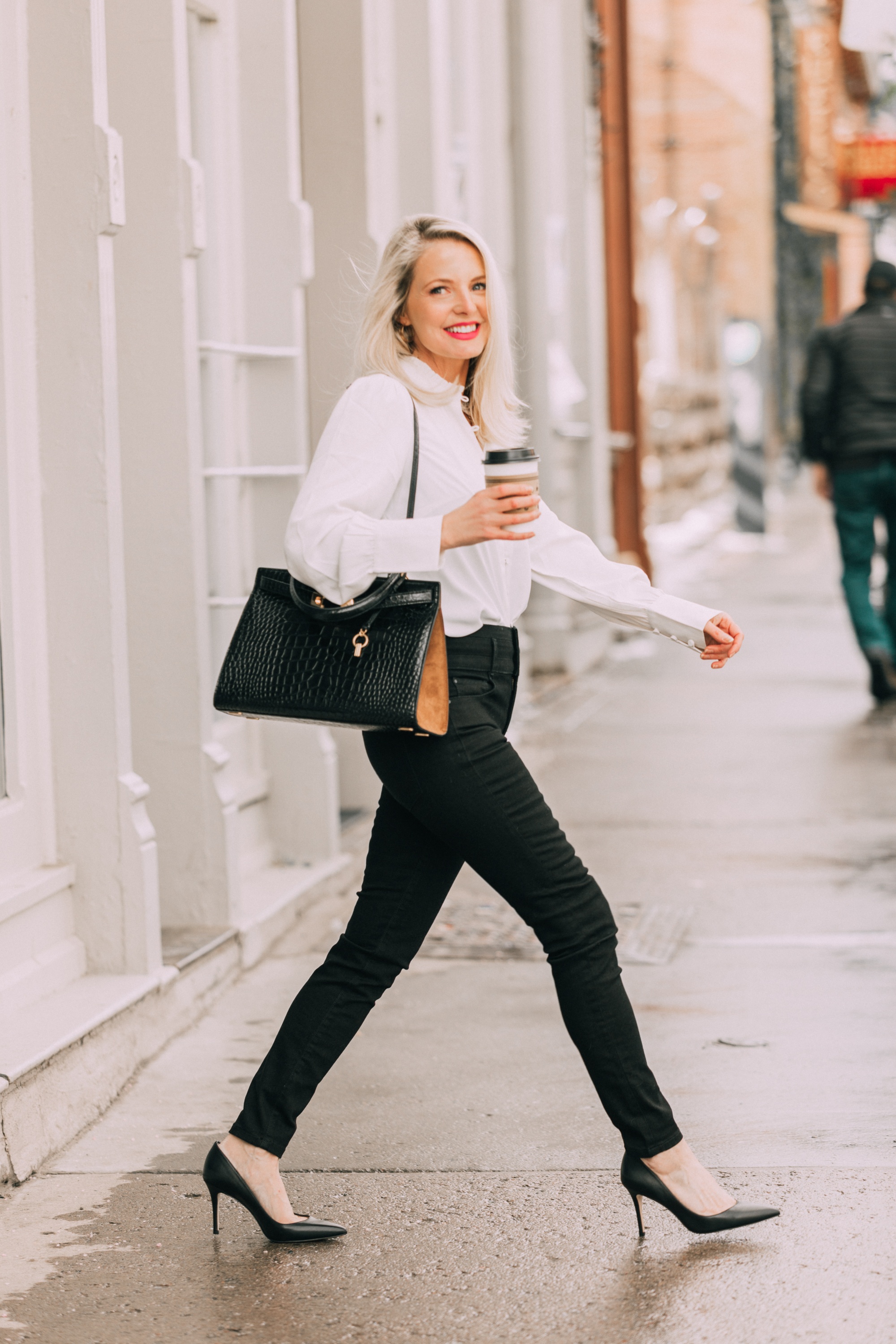 Wardrobe Basics, Fashion blogger Erin Busbee of BusbeeStyle.com wearing black pocket sculpting jeans, a white ruffle neck blouse, black pumps, bar link necklace, and cutout hoops earrings all from Ann Taylor in Telluride, Colorado