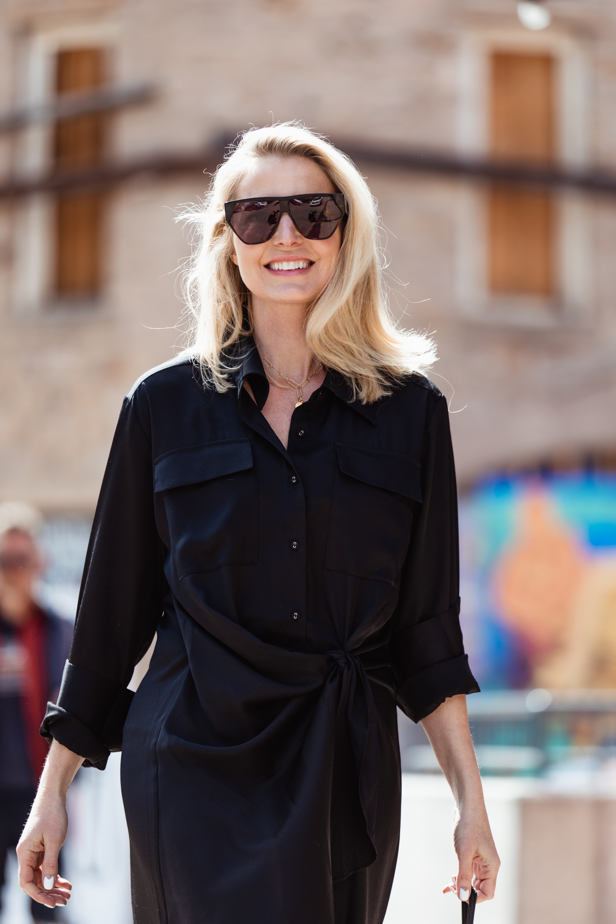 Spring Accessories, Fashion blogger Erin Busbee of BusbeeStyle.com wearing a black L'Academie shirt dress with transparent and leopard strap heels and black bracelet bag from Vince Camuto walking in Telluride, Colorado