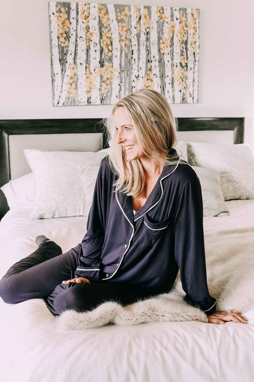 Nordstrom surprise sale featuring long sleeve pajama sets in navy with white piping on fashion blogger over 40 Erin Busbee of Busbee Style