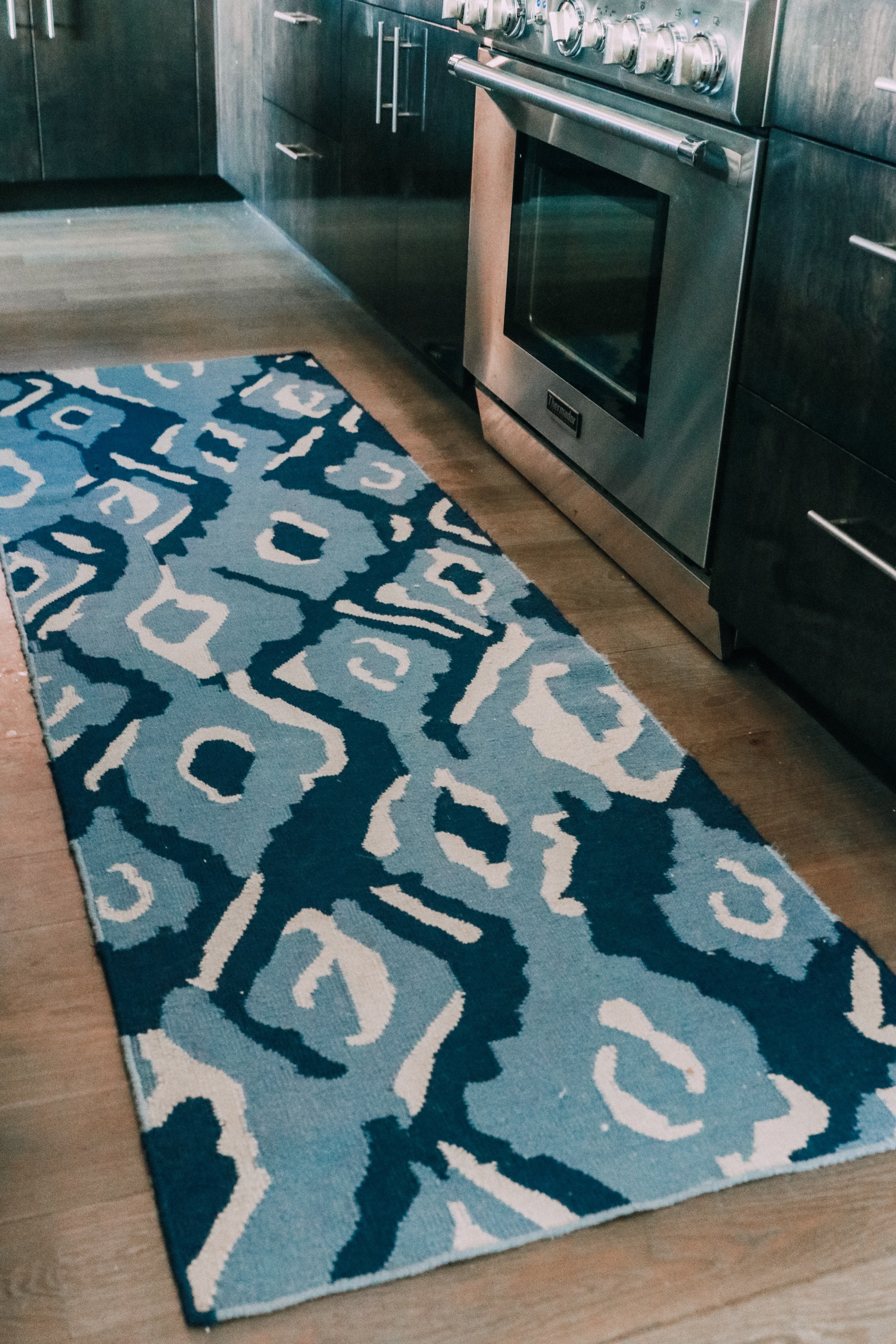 blue and white ikat kitchen rug runner by stove House Tour modern mountain townhome Telluride Colorado