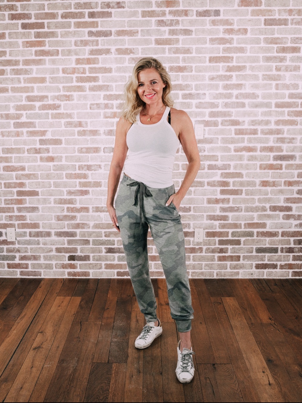 Loungewear Outfits, Fashion blogger Erin Busbee of BusbeeStyle.com sharing her favorite loungewear including a white tank and camo joggers by Sundry in Telluride, Colorado, stylish lazy day outfits