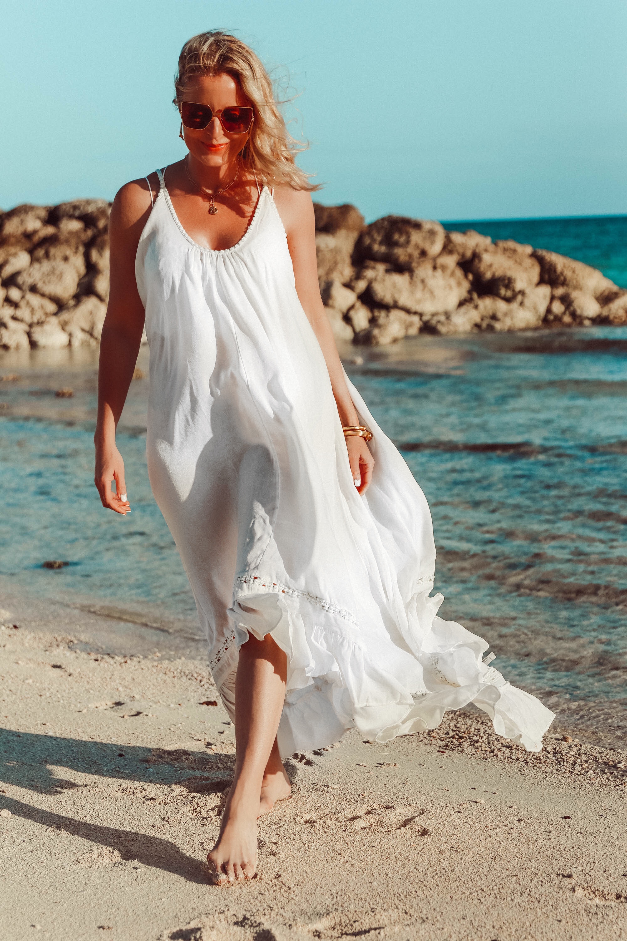 Best Coverups, Fashion blogger Erin Busbee of BusbeeStyle.com wearing a white Free People maxi dress and white lace bralette in the Bahamas
