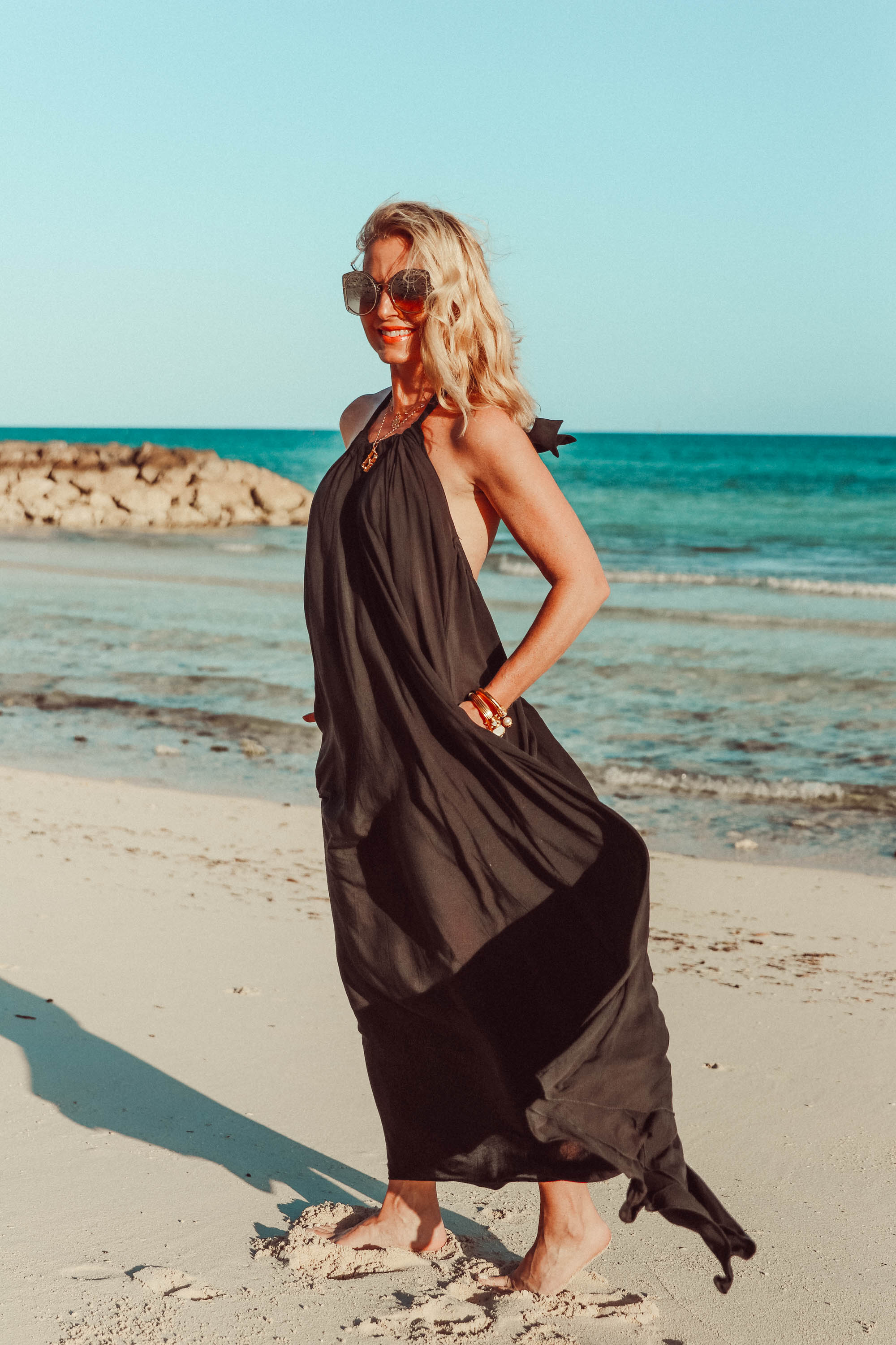 Best Coverups, Fashion blogger Erin Busbee of BusbeeStyle.com wearing a black halter neck coverup by Elan on the beach in the Bahamas