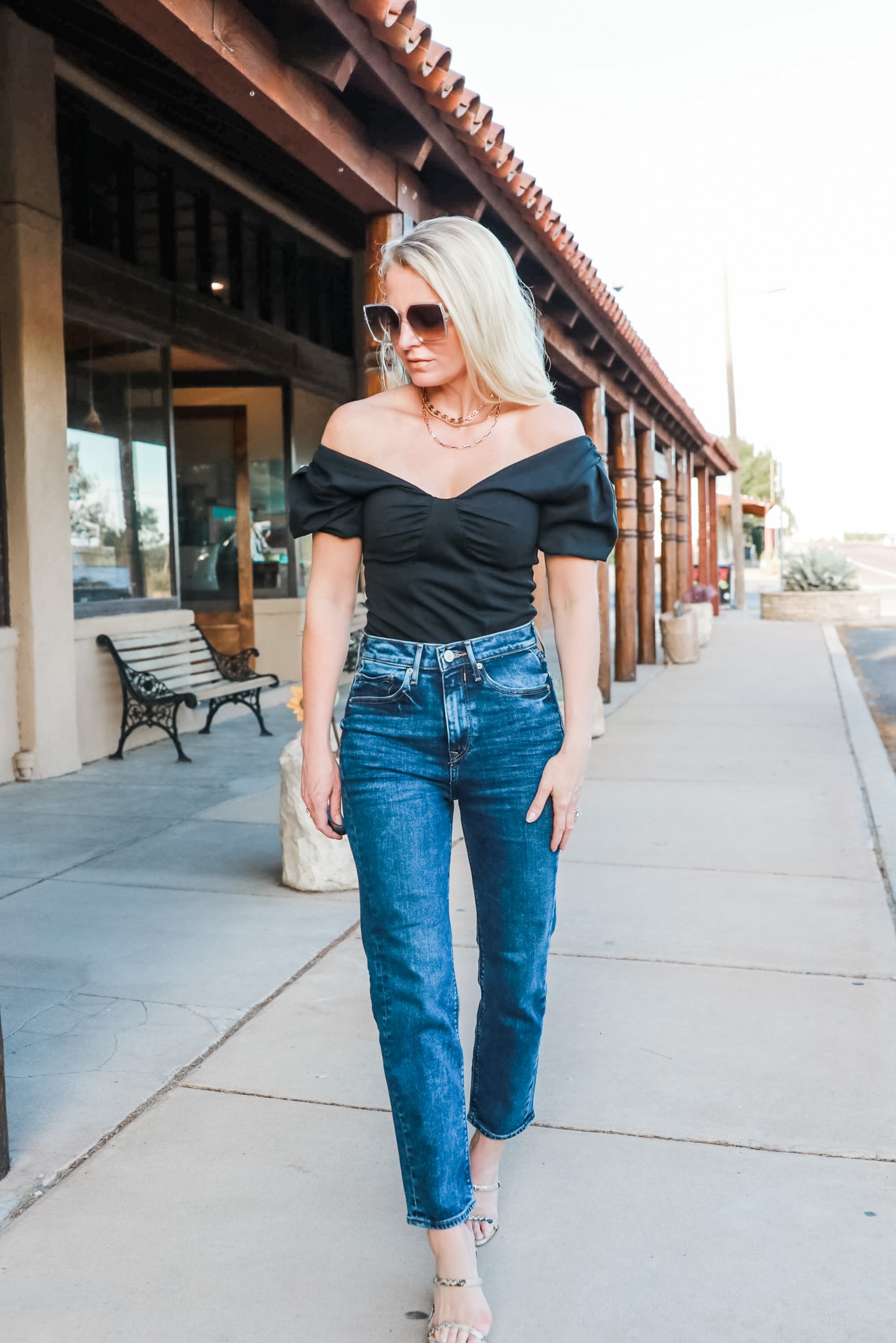 fashion blogger outfit Express super high waisted dark wash Mom jeans black bodysuit python heeled sandals at Gage Hotel Texas