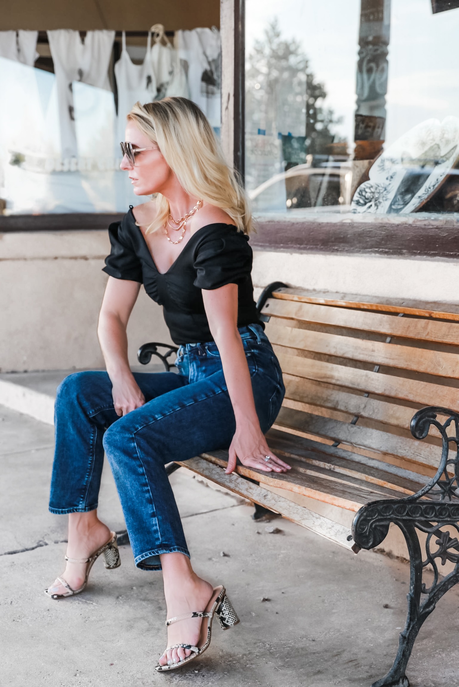 Express super high waisted dark wash Mom Jeans outfit over black off the shoulder thong bodysuit shiny gold layered three chain necklace fashion blogger at Gage Hotel Texas