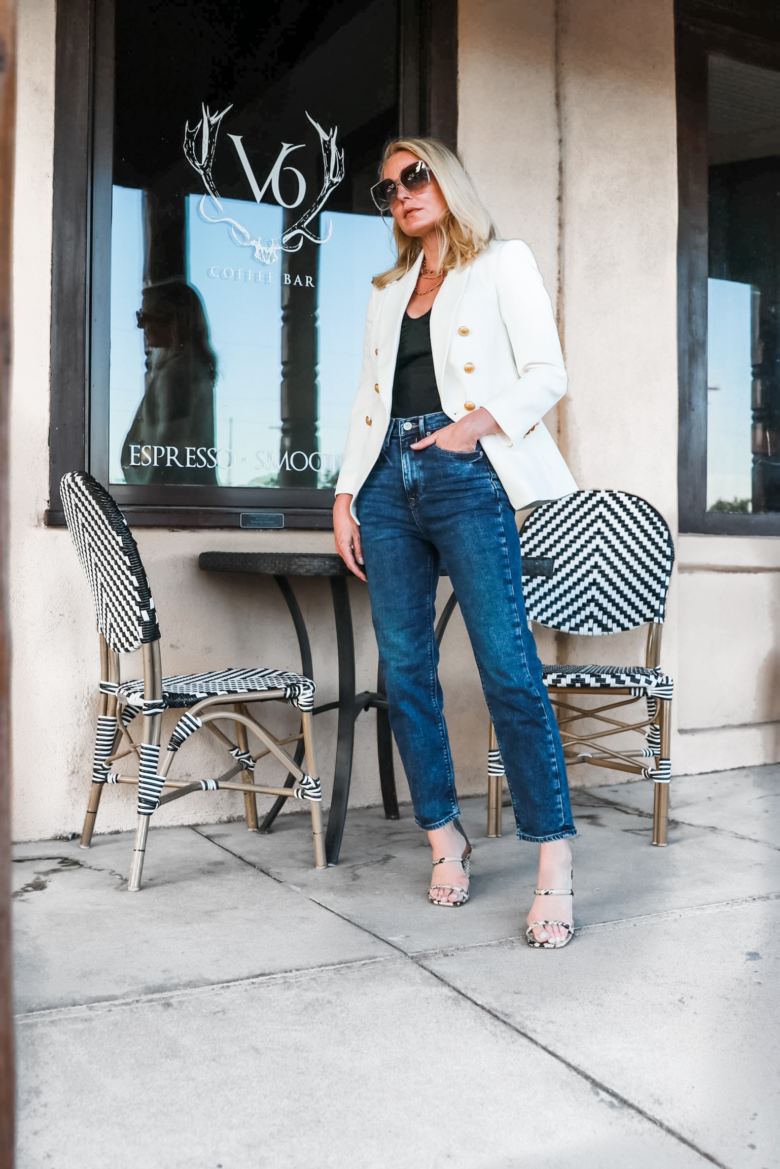 Affordable White Blazer, Fashion blogger Erin Busbee of Busbee Style wearing a white double breasted blazer, mom jeans, black puff shoulder bodysuit, and python sandals from Express in west Texas