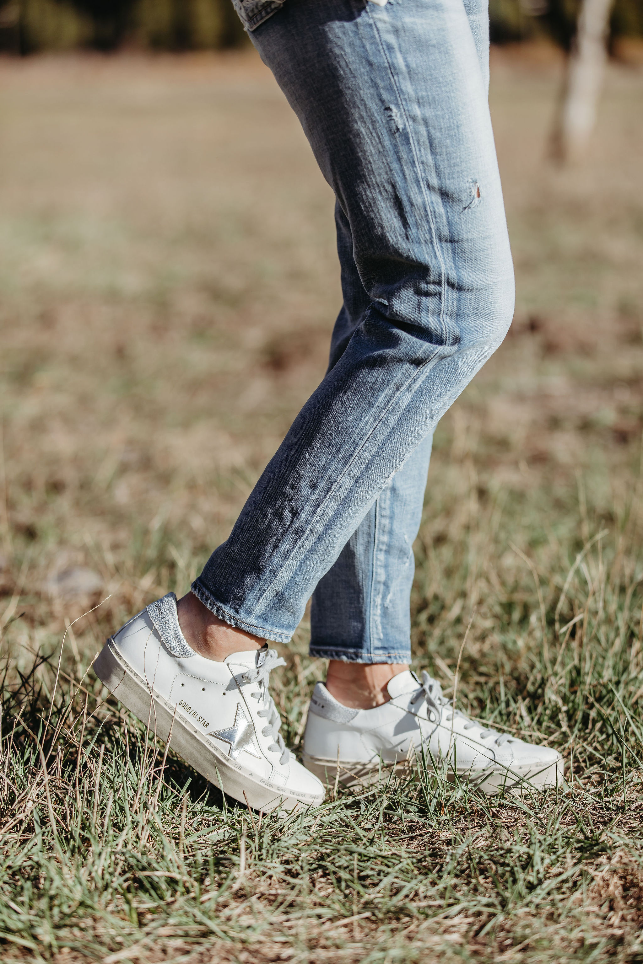 Lightweight Shirts For Summer, Fashion blogger Erin Busbee of BusbeeStyle.com wearing Moussy Vintage tapered jeans and Golden Goose platform sneakers from Nordstrom in Telluride, Colorado
