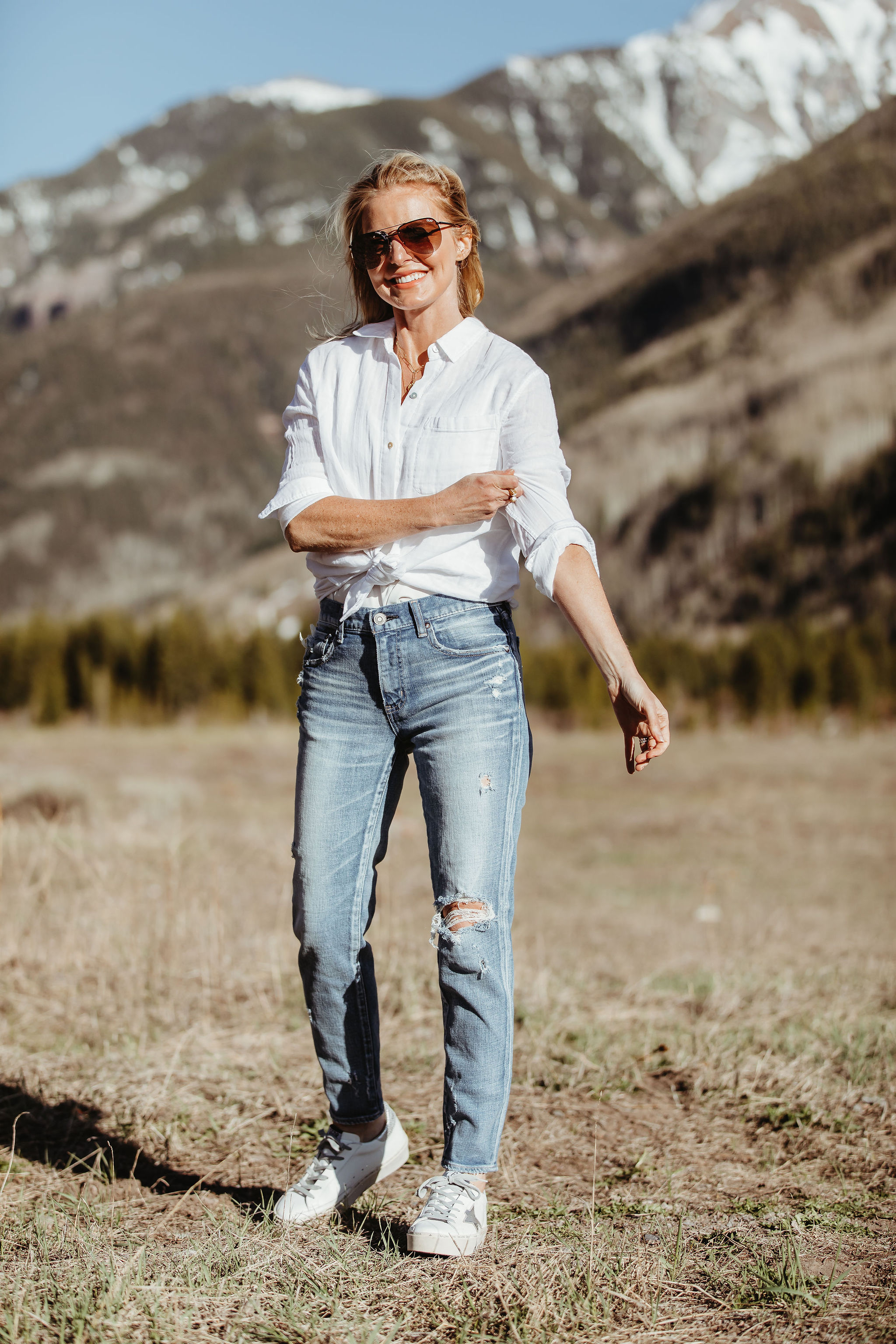 Lightweight Shirts For Summer, Fashion blogger Erin Busbee of BusbeeStyle.com wearing the white cotton Rails Ellis shirt with Moussy Vintage tapered jeans and Golden Goose platform sneakers from Nordstrom in Telluride, Colorado