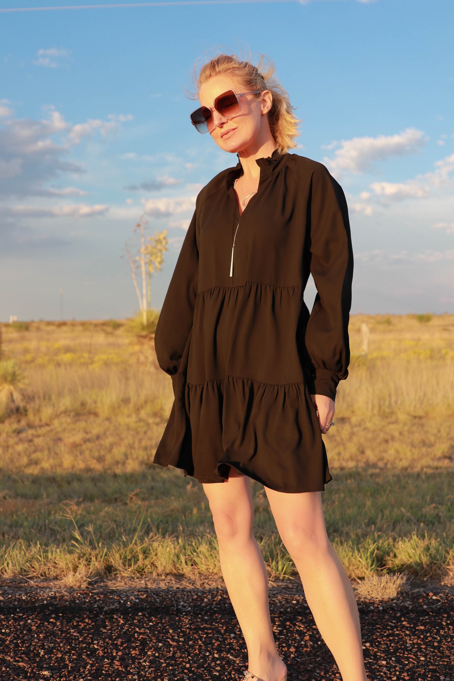 Dress For Summer, Fashion blogger Erin Busbee of Busbee Style wearing a black long sleeve tiered Amanda Uprichard dress with a Kendra Scott adjustable necklace, Saint Laurent sunglasses, and Valentino sandals in south Texas, Best dresses for summer, cute summer dresses, comfy summer dresses, cotton summer dresses, comfortable summer dresses, airy summer dresses, summer dresses with pockets, lightweight summer dresses, best dresses for travel, summer dresses for beach vacation
