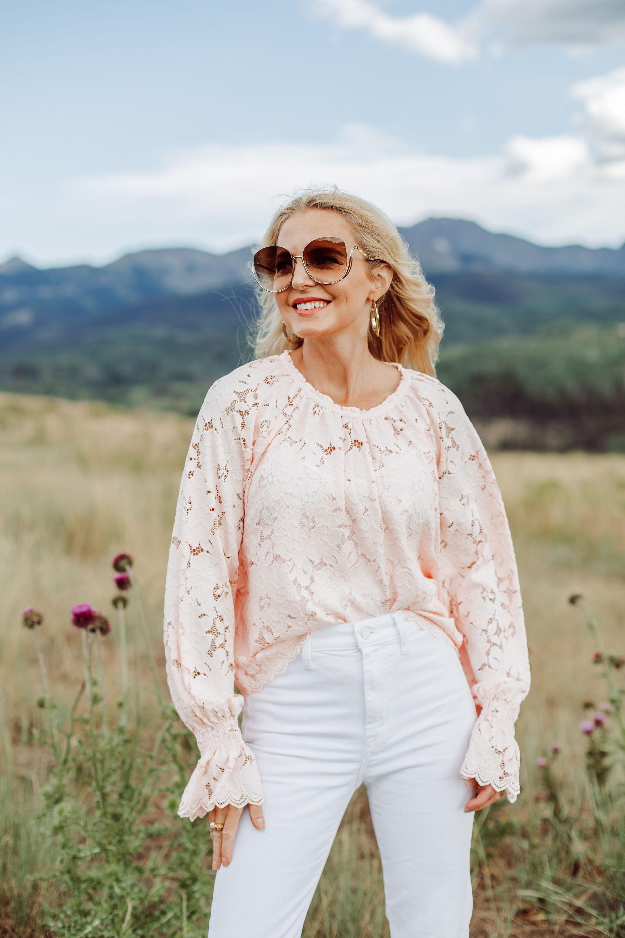 White Jeans Over 40, Fashion blogger Busbee Style wearing white 7 For All Mankind split hem jeans, pink lace long sleeve Free People top in Telluride, Colorado