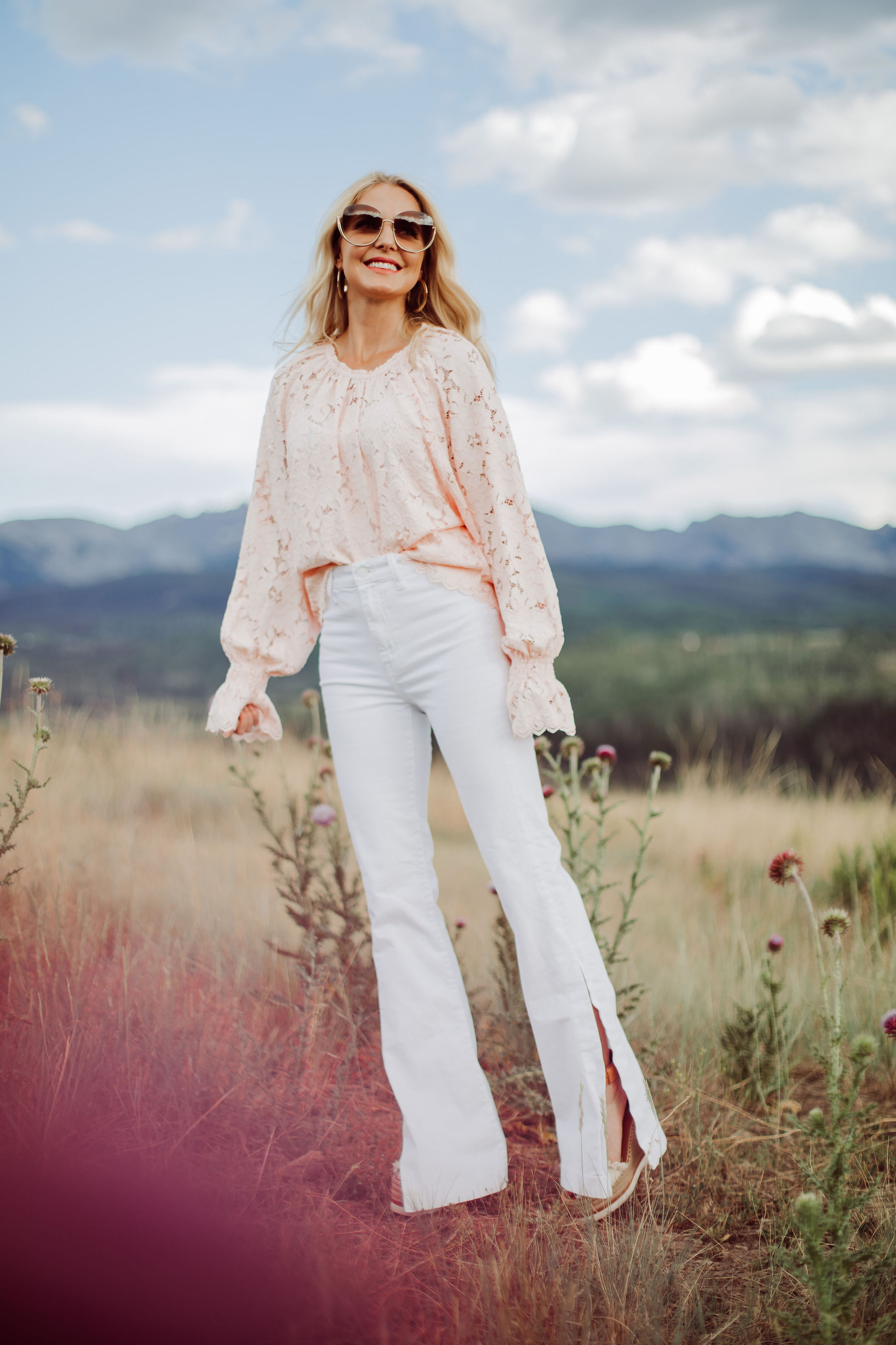White Jeans Over 40, Fashion blogger Erin Busbee of Busbee Style wearing white 7 For All Mankind split hem jeans with See by Chloe espadrille wedges and pink lace long sleeve Free People top in Telluride, Colorado