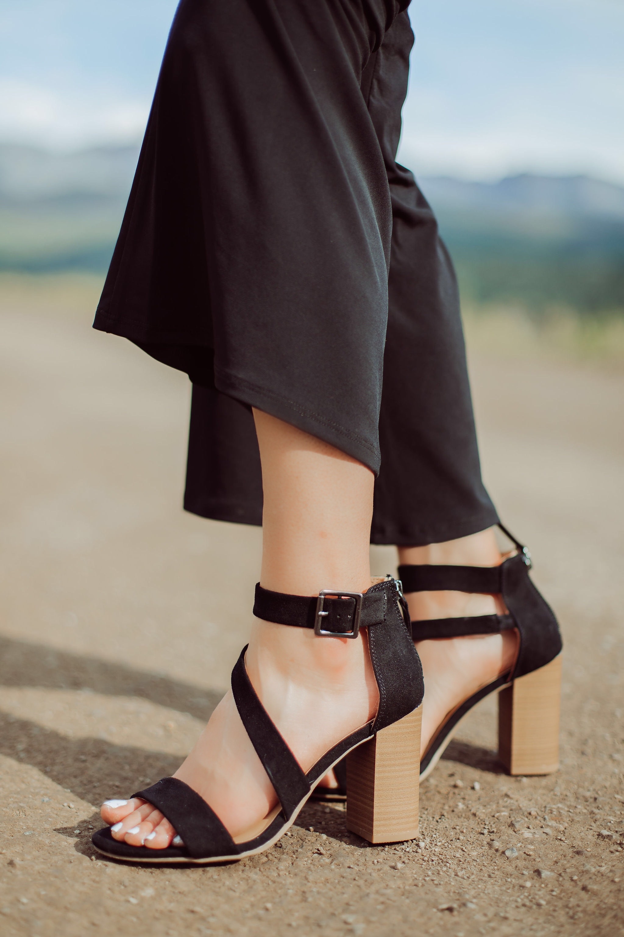 Jumpsuits Over 40, Fashion Blogger Erin Busbee of Busbee Style wearing a black flared jumpsuit by Scoop and black strappy block heel sandals by Scoop from Walmart in Telluride, Colorado