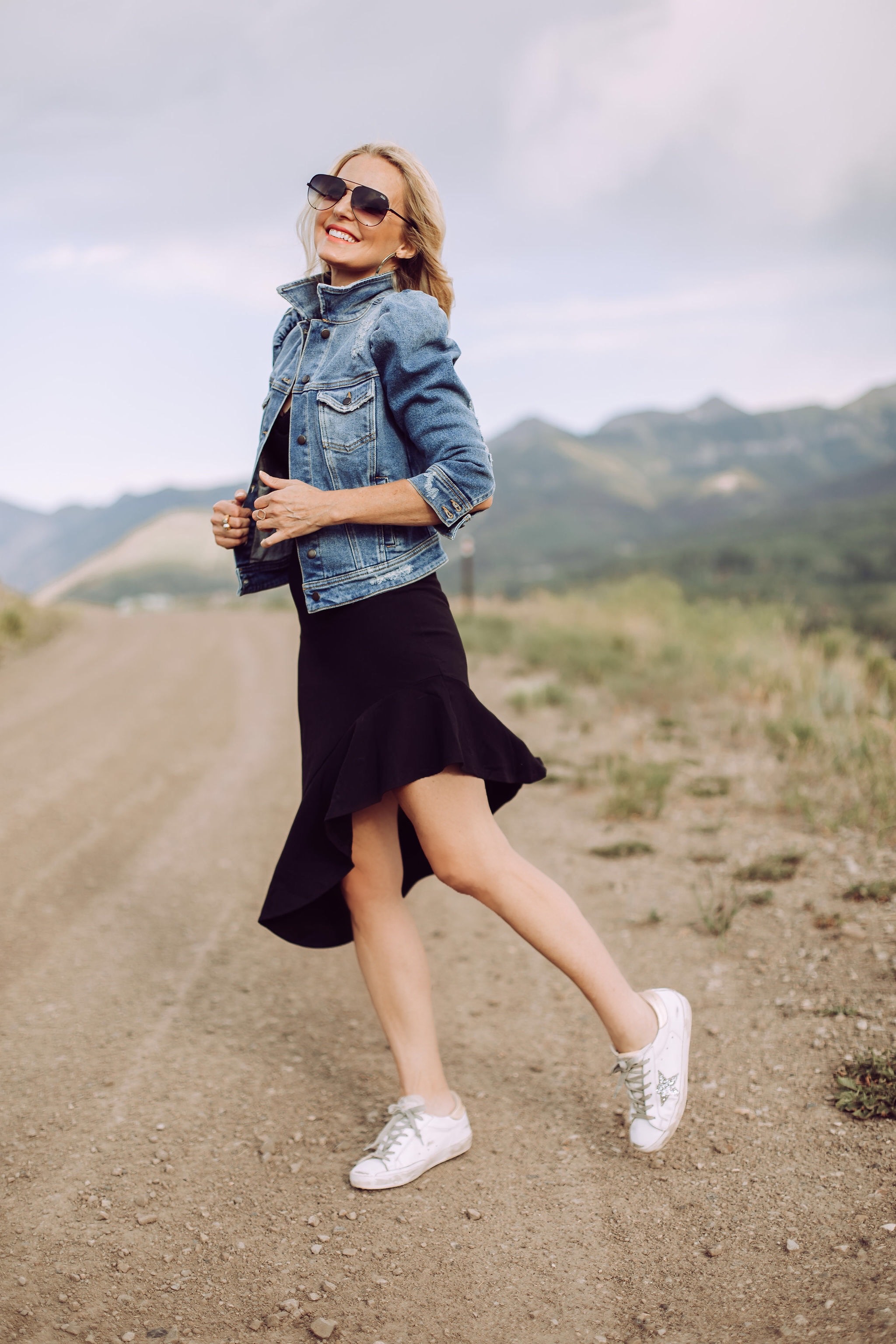 Day To Date Night Outfits, fashion blogger Busbee Style wearing black susana monaco dress, golden goose sneakers, retrofete denim puff sleeve jacket, aviator sunglasses in Telluride, Colorado