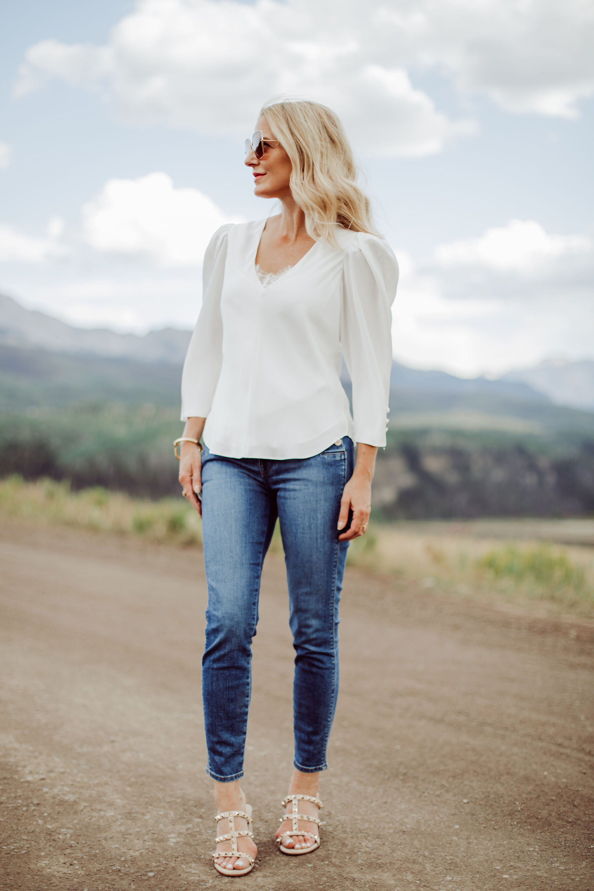 Frame Blouses, Fashion blogger Busbee Style wearing white Frame puff sleeve blouse, Valentino sandals, J Brand Natasha blue jeans in Telluride, Colorado