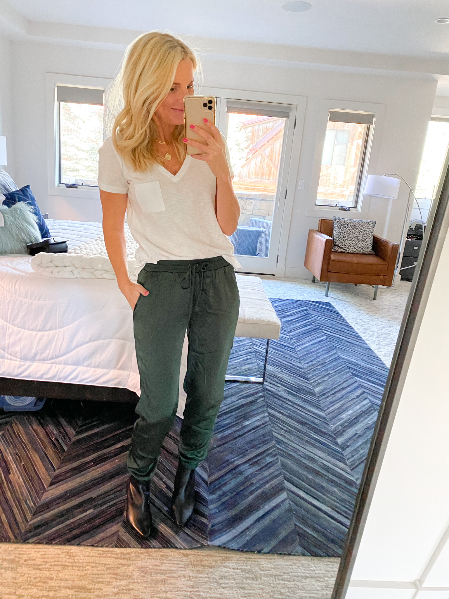 Nordstrom Sale Outfits, Fashion Blogger Erin Busbee Of Busbee Style Wearing A White Madewell Tee, Green Satin Joggers By Socialite, And Black Booties By Louise Et Cie In Telluride, Colorado