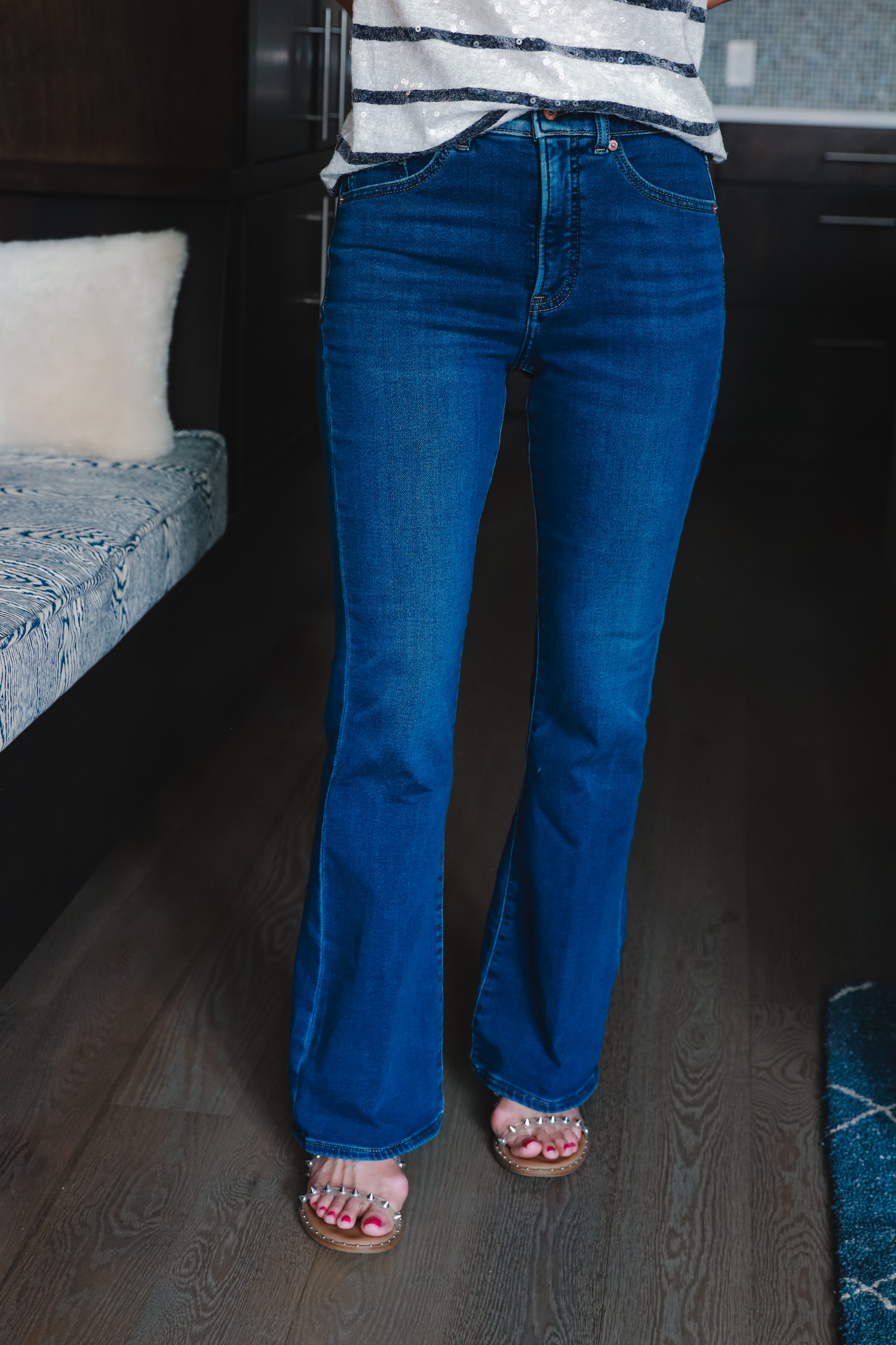 Express Denim, Fashion blogger Erin Busbee of Busbee Style wearing Luxe Comfort knit dark wash flare jeans and striped sequin shirt from Express with Steve Madden clear studded sandals in Telluride, Colorado