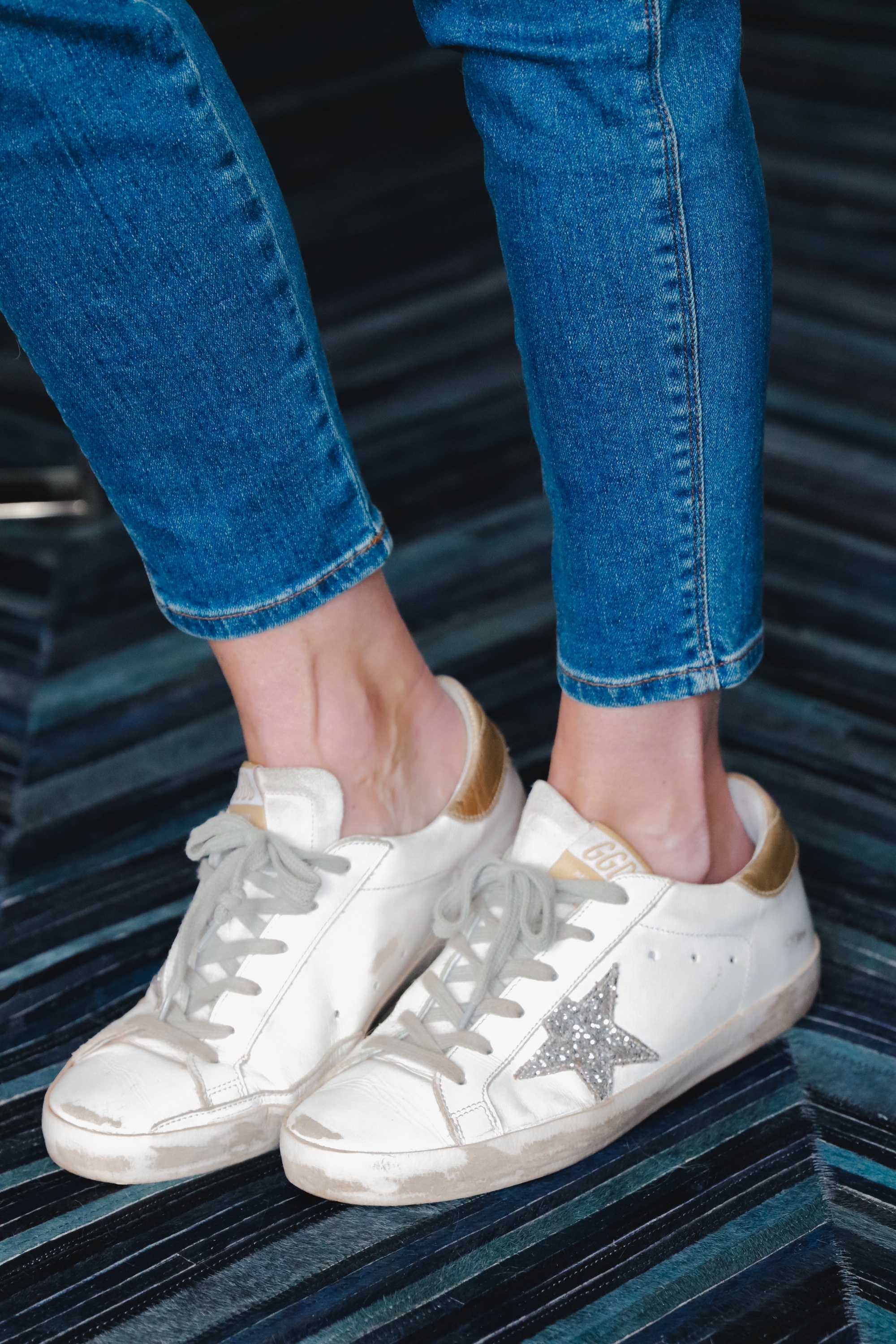white golden goose all star low top sneakers with J Brand Natasha skinny blue jeans