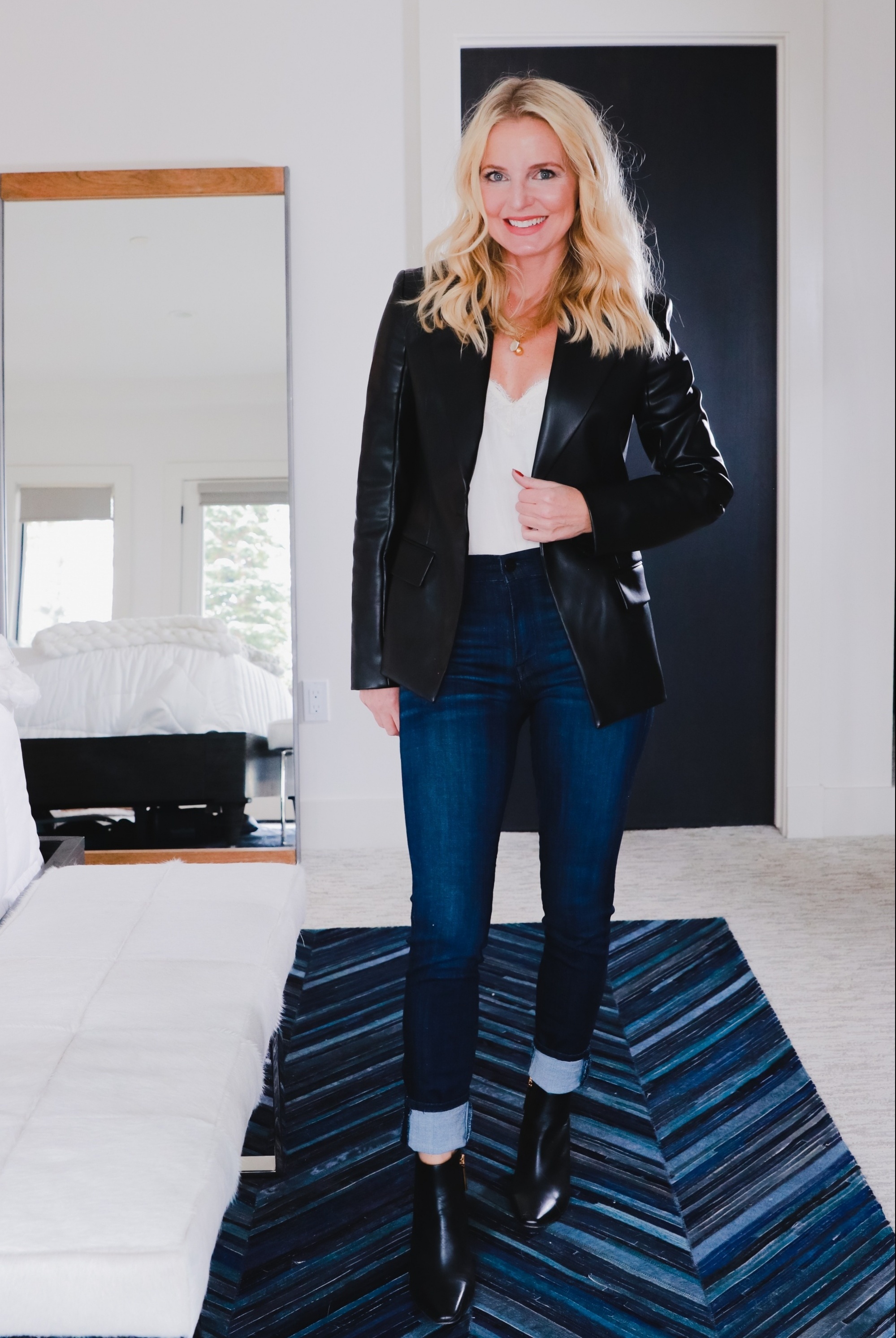 Boots With Jeans, Erin Busbee of Busbee Style sharing the complete guide to wearing jeans and booties wearing Frame skinny jeans, Louise et Cie black booties, a black Theory faux leather blazer, and white BP lace cami in her home in Telluride, Colorado
