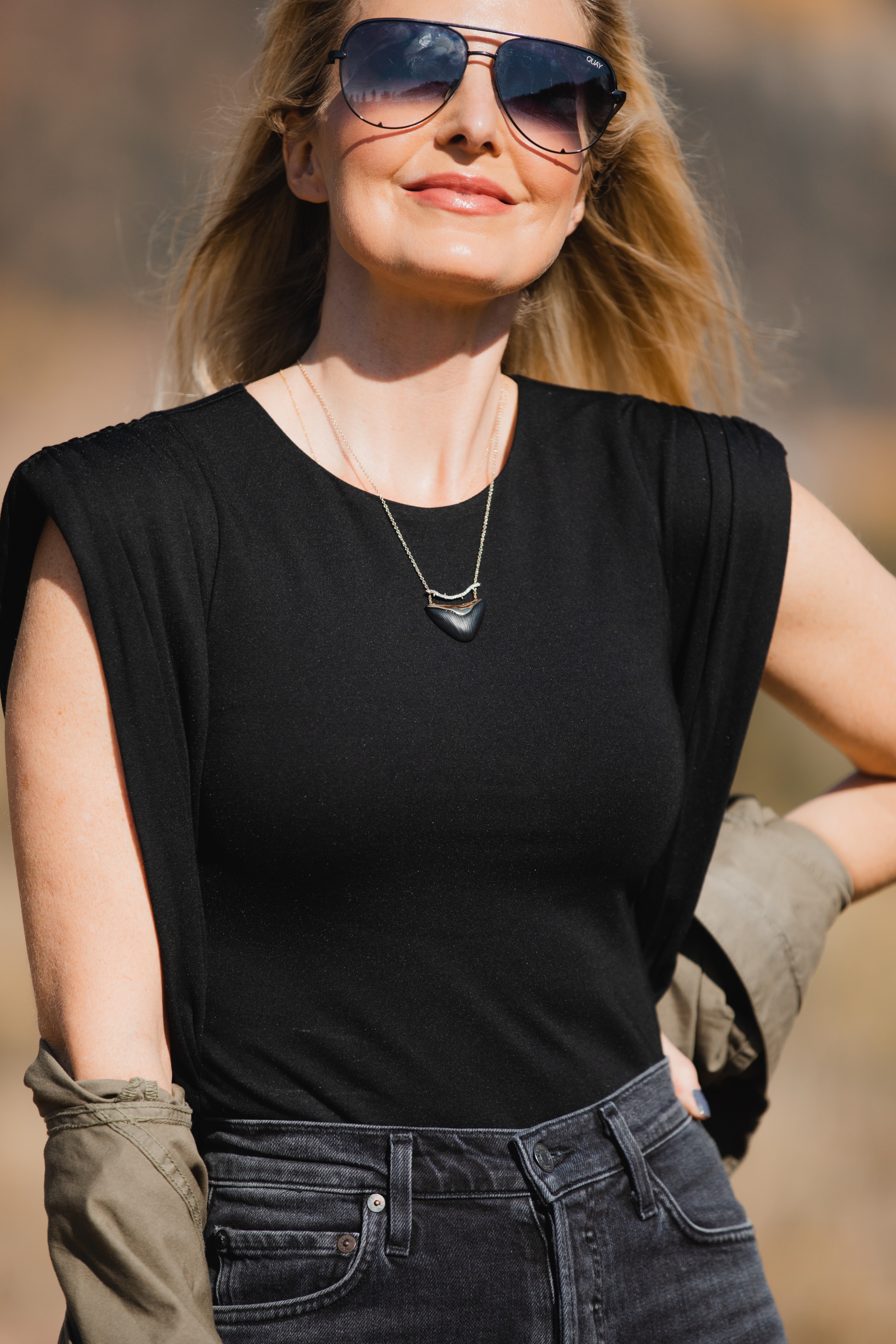 How To Wear A Cargo Jacket, Erin Busbee of Busbee Style wearing a green cargo jacket by rag & bone, black muscle tee tank by Aqua, gray wash Nico slim fit jeans by Agolde, QUAY sunglasses, and Alexander Wang cutout booties from Bloomingdale's in Telluride, Colorado