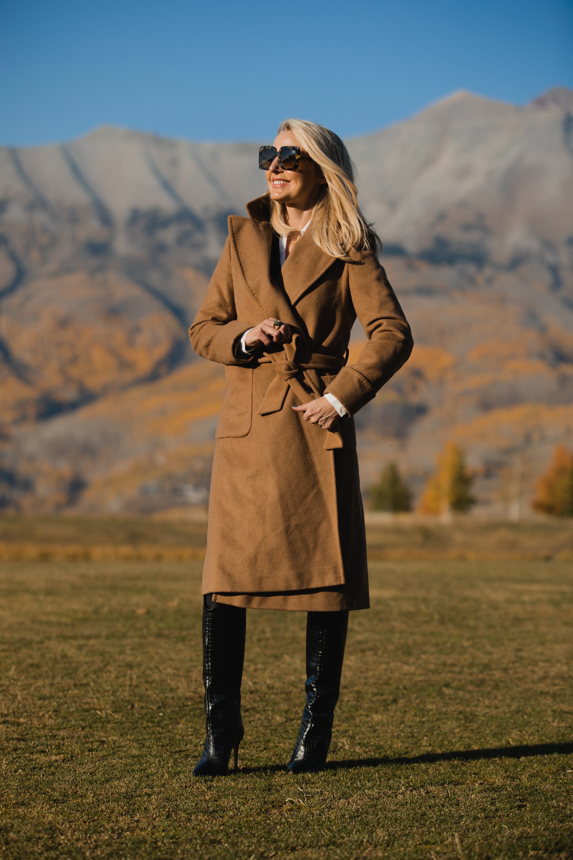 Perfect Camel Coat, Erin Busbee of Busbee Style wearing a Ralph Lauren camel wool wrap coat over a brown brochu walker layered sweater, spanc faux leather leggings, and shutz black croc embossed leggings in Telluride, Colorado
