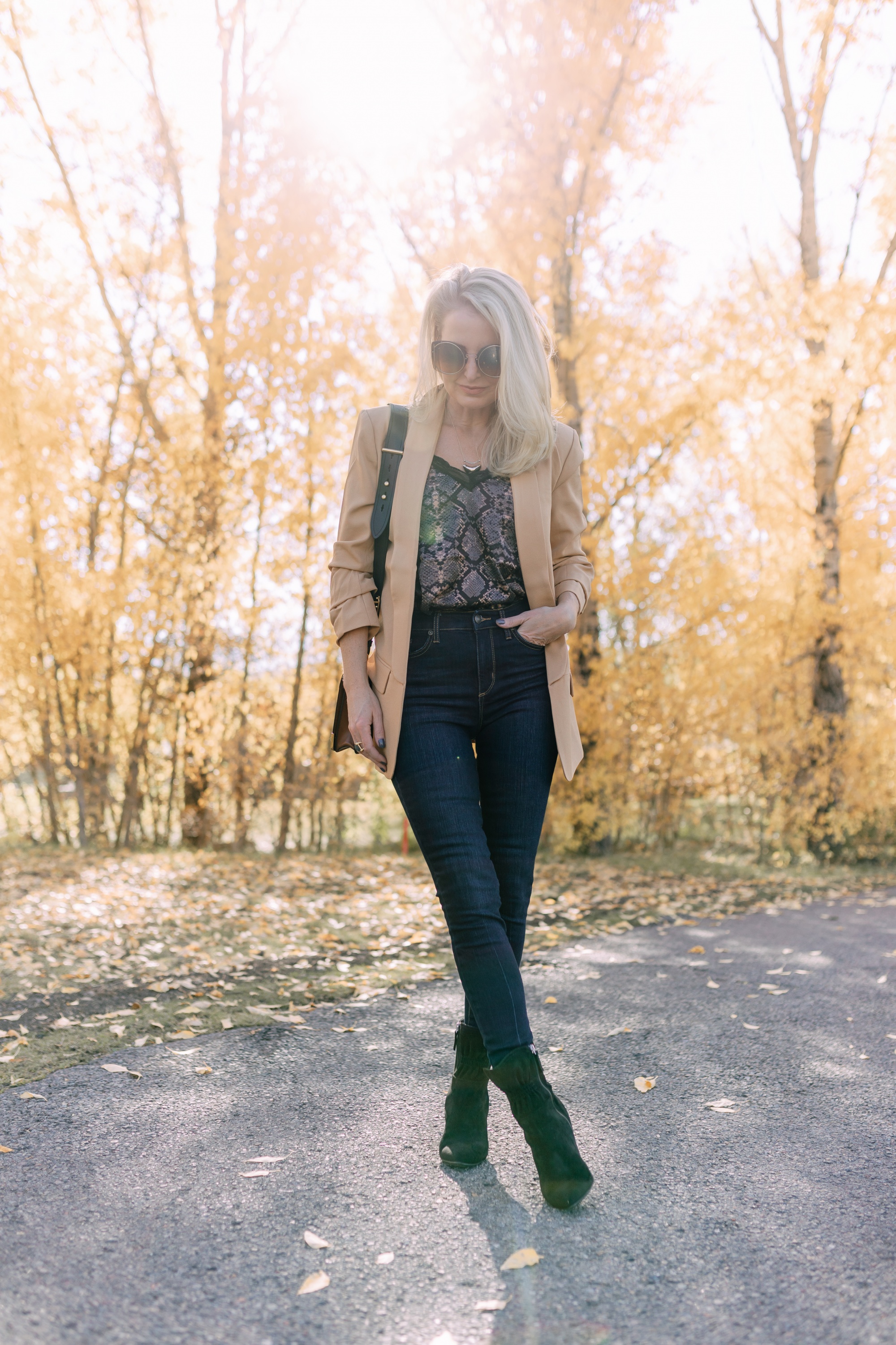 Affordable Fall Fashion, Erin Busbee of Busbee Style wearing dark wash skinny jeans by Scoop, a camel boyfriend blazer by Scoop, a black lacy python print camisole by Scoop, black scrunch stiletto booties by Scoop, Prada Cahier black and brown bag, and Salvatore Ferragamo sunglasses in Telluride, Colorado