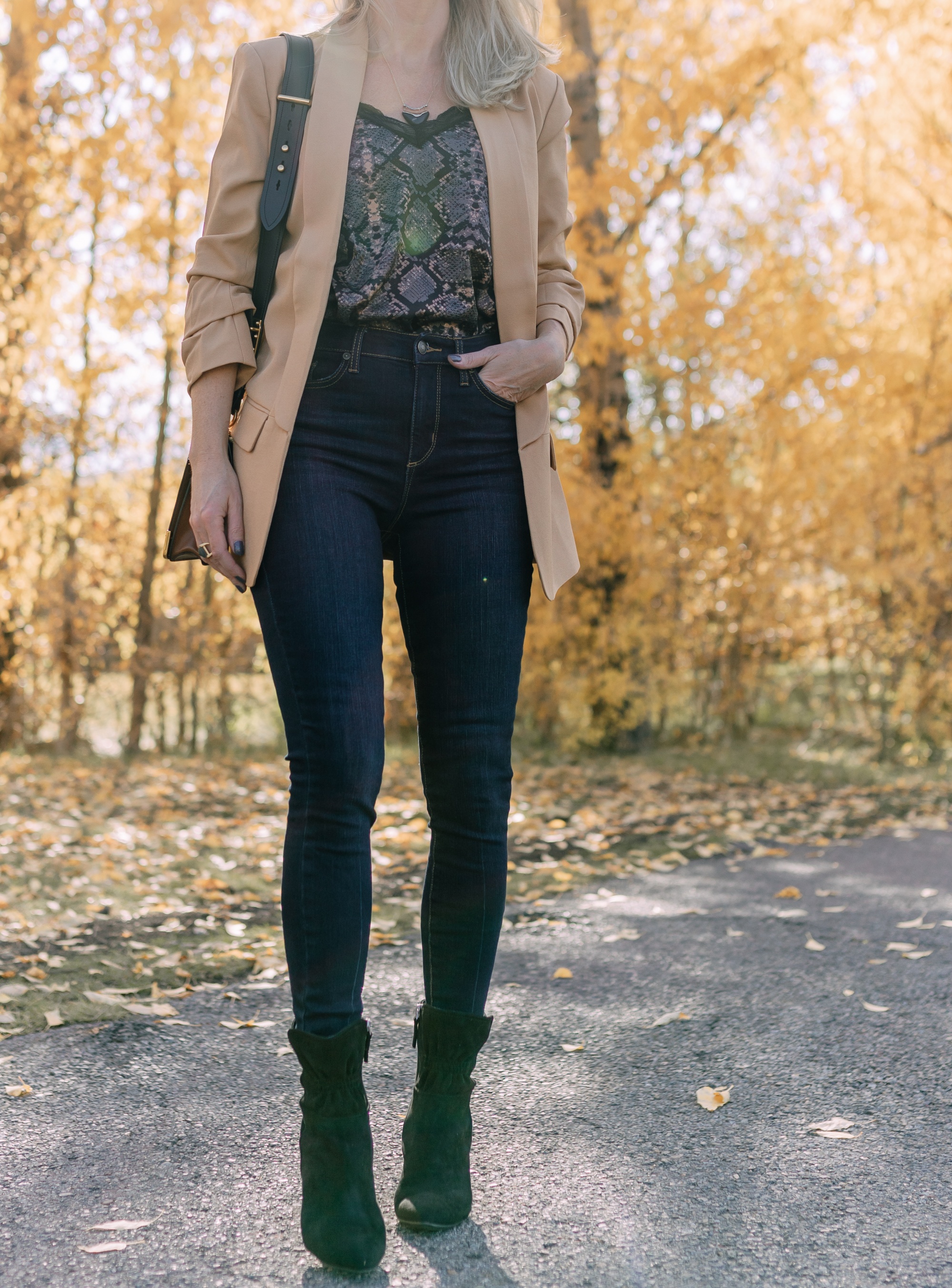 Affordable Fall Fashion, Erin Busbee of Busbee Style wearing dark wash skinny jeans by Scoop, a camel boyfriend blazer by Scoop, a black lacy python print camisole by Scoop, black scrunch stiletto booties by Scoop, Prada Cahier black and brown bag, and Salvatore Ferragamo sunglasses in Telluride, Colorado