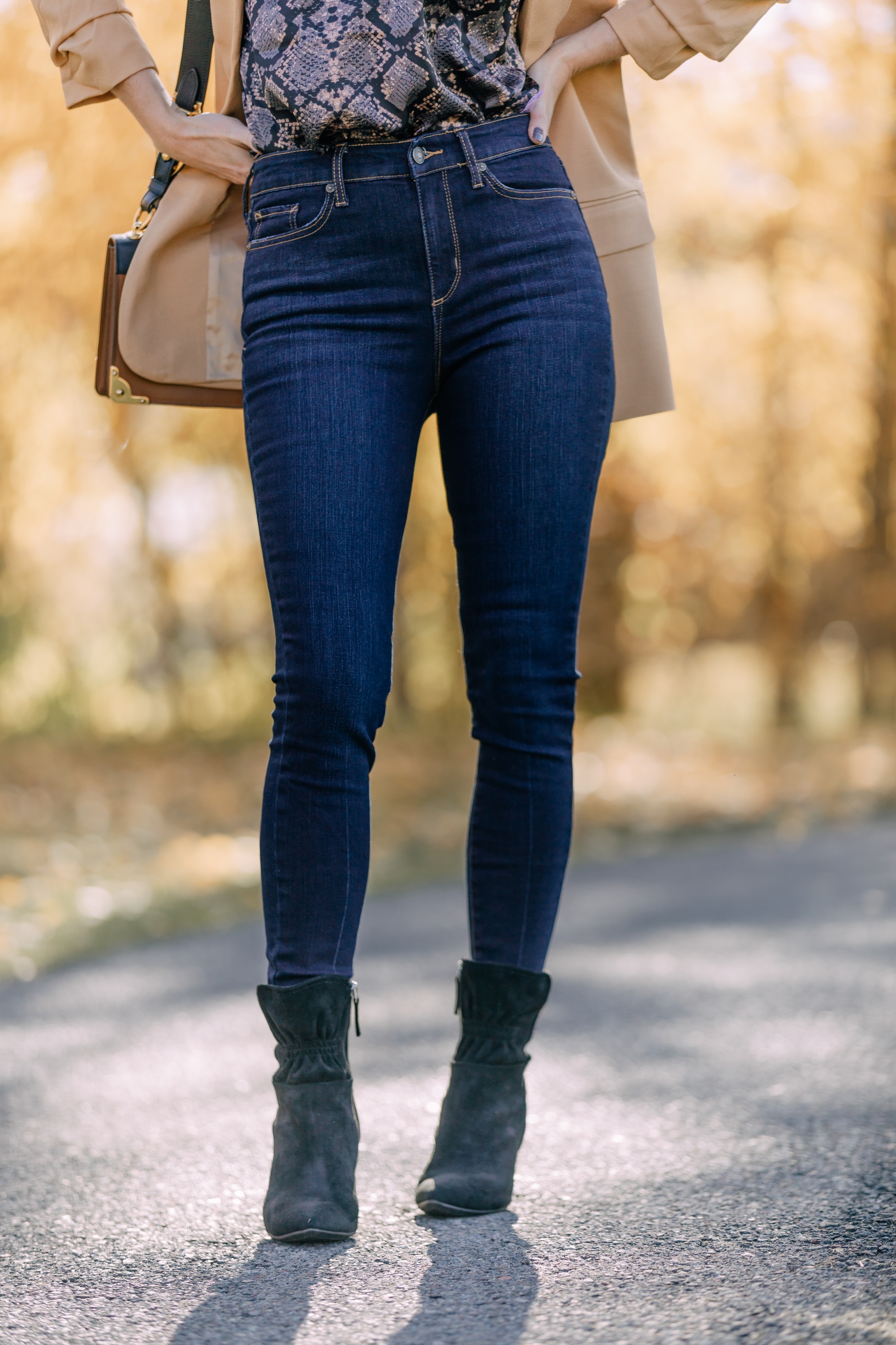 Affordable Fall Fashion, Erin Busbee of Busbee Style wearing dark wash skinny jeans by Scoop, a camel boyfriend blazer by Scoop, a black lacy python print camisole by Scoop, black scrunch stiletto booties by Scoop, Prada Cahier black and brown bag, and Salvatore Ferragamo sunglasses in Telluride, Colorado